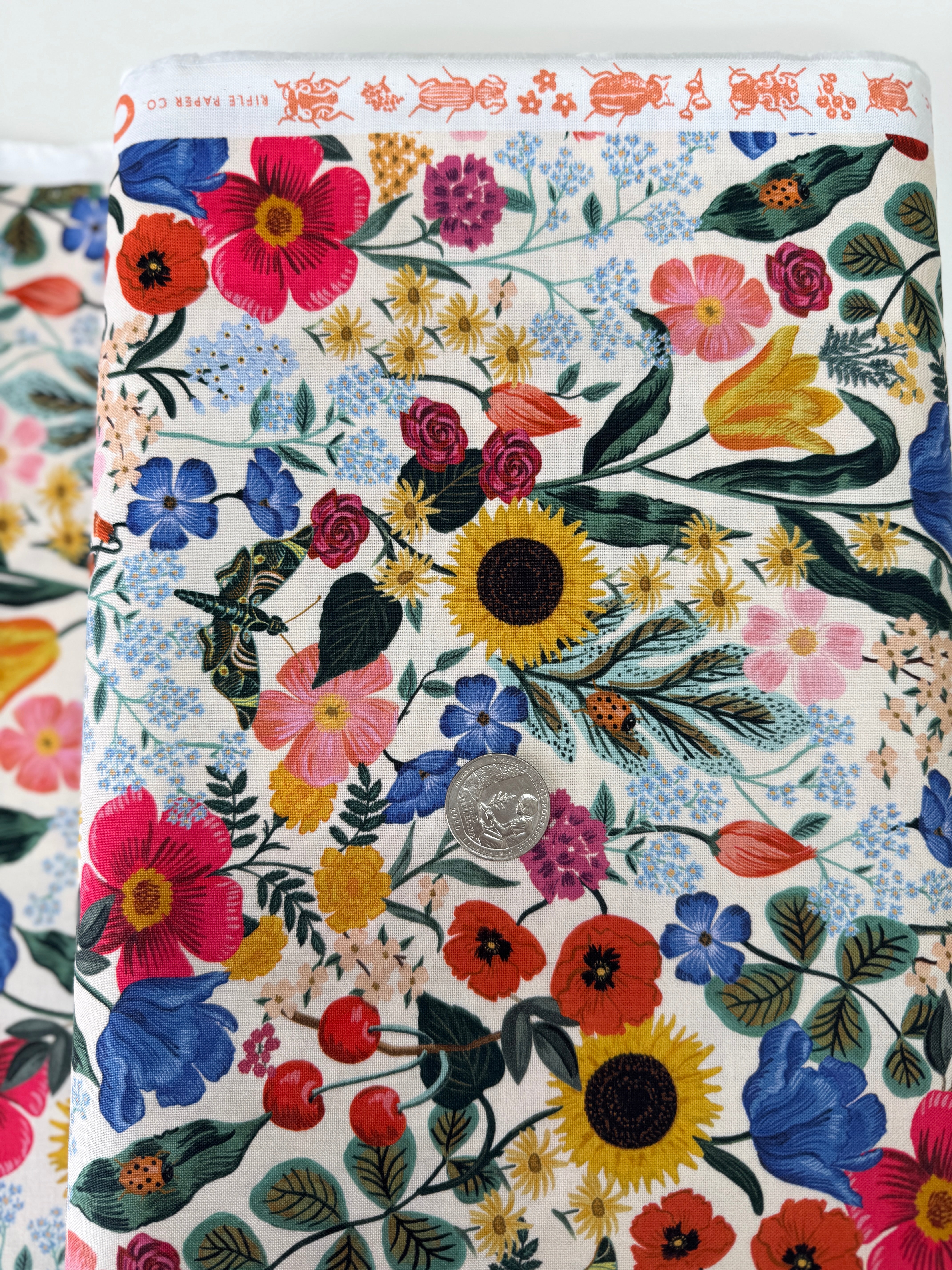 Curio Blossom Blush digiprint cotton fabric by Rifle Paper Co. for Cotton + Steel featuring soft pink floral blossoms.