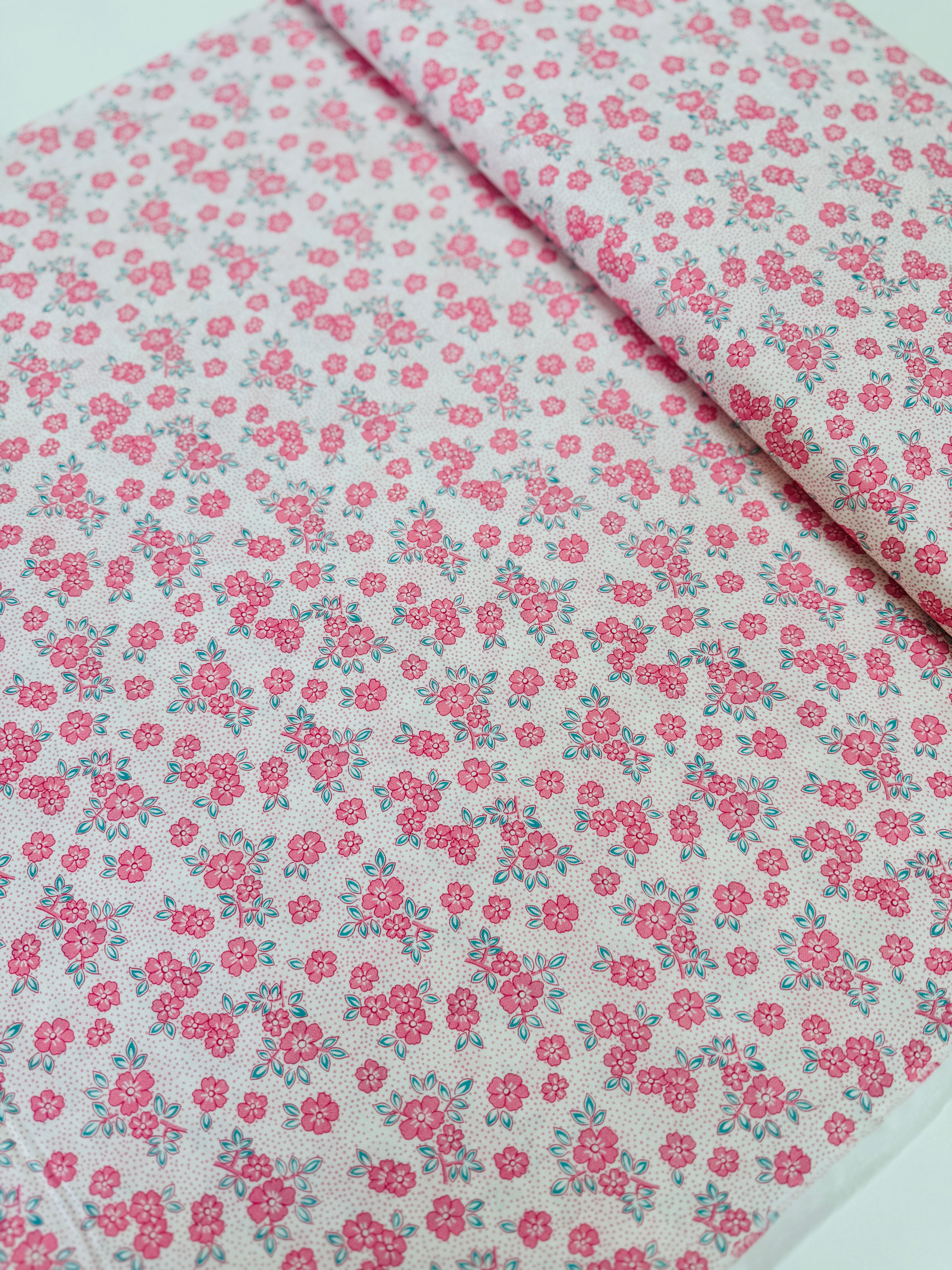 At The Cottage Florals Dots Camellia quilting cotton by Robert Kaufman featuring camellia blossoms and dot accents.