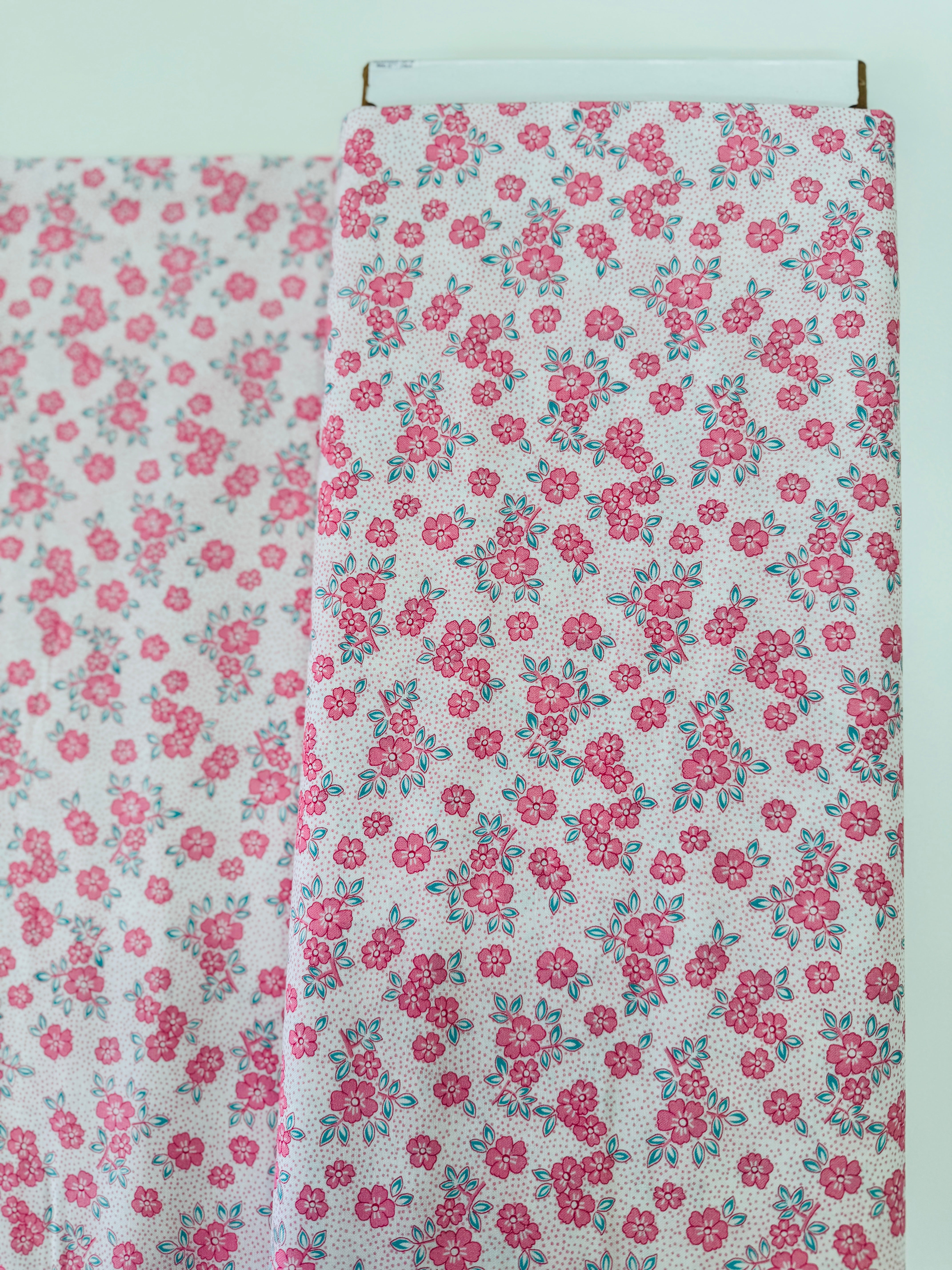 At The Cottage Florals Dots Camellia quilting cotton by Robert Kaufman featuring camellia blossoms and dot accents.