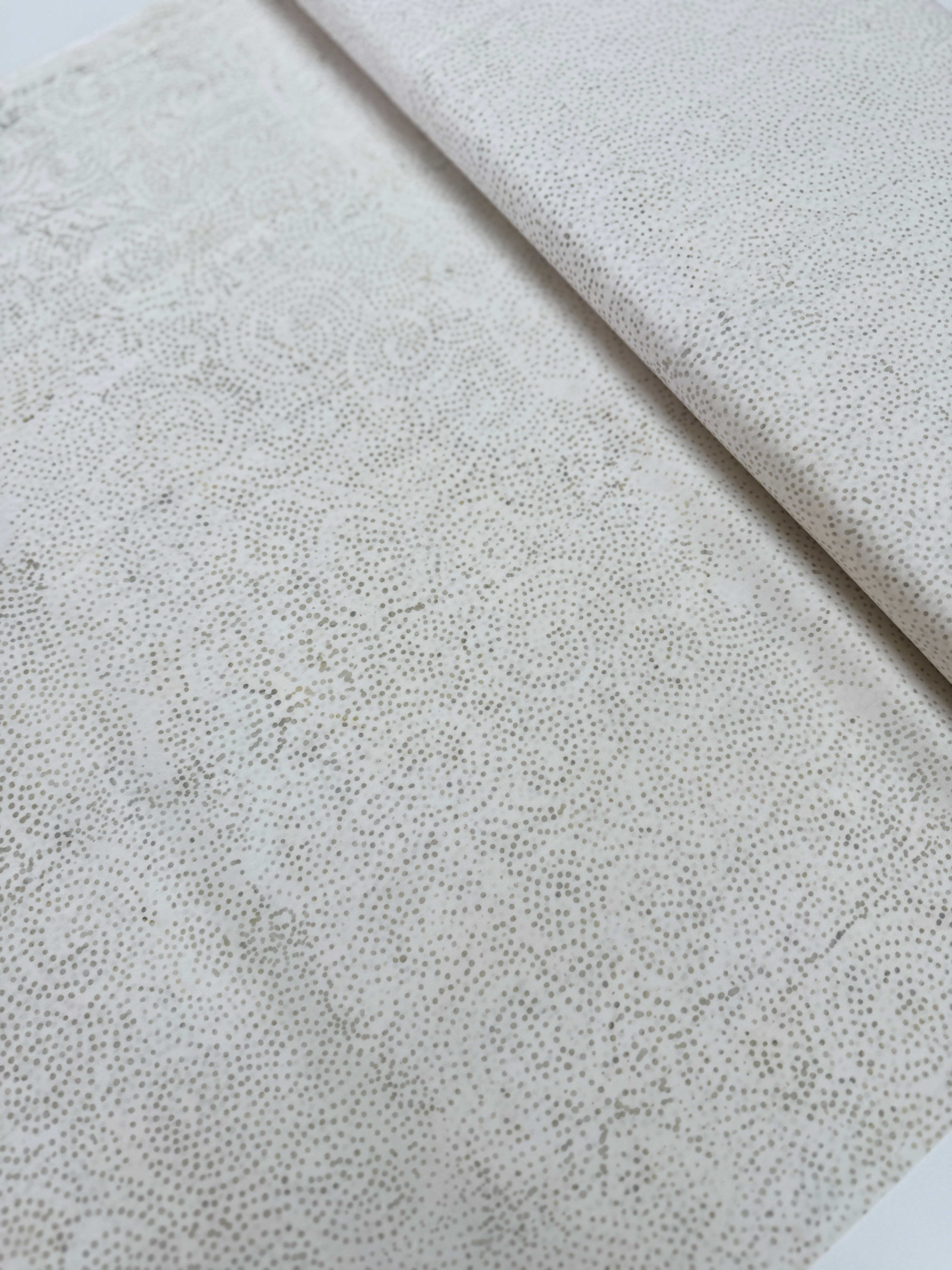 Tonga Stormy Sea Cosmic Sky Bone hand‑dyed cotton batik fabric by Wing and a Prayer for Timeless Treasures in neutral ombre tones.