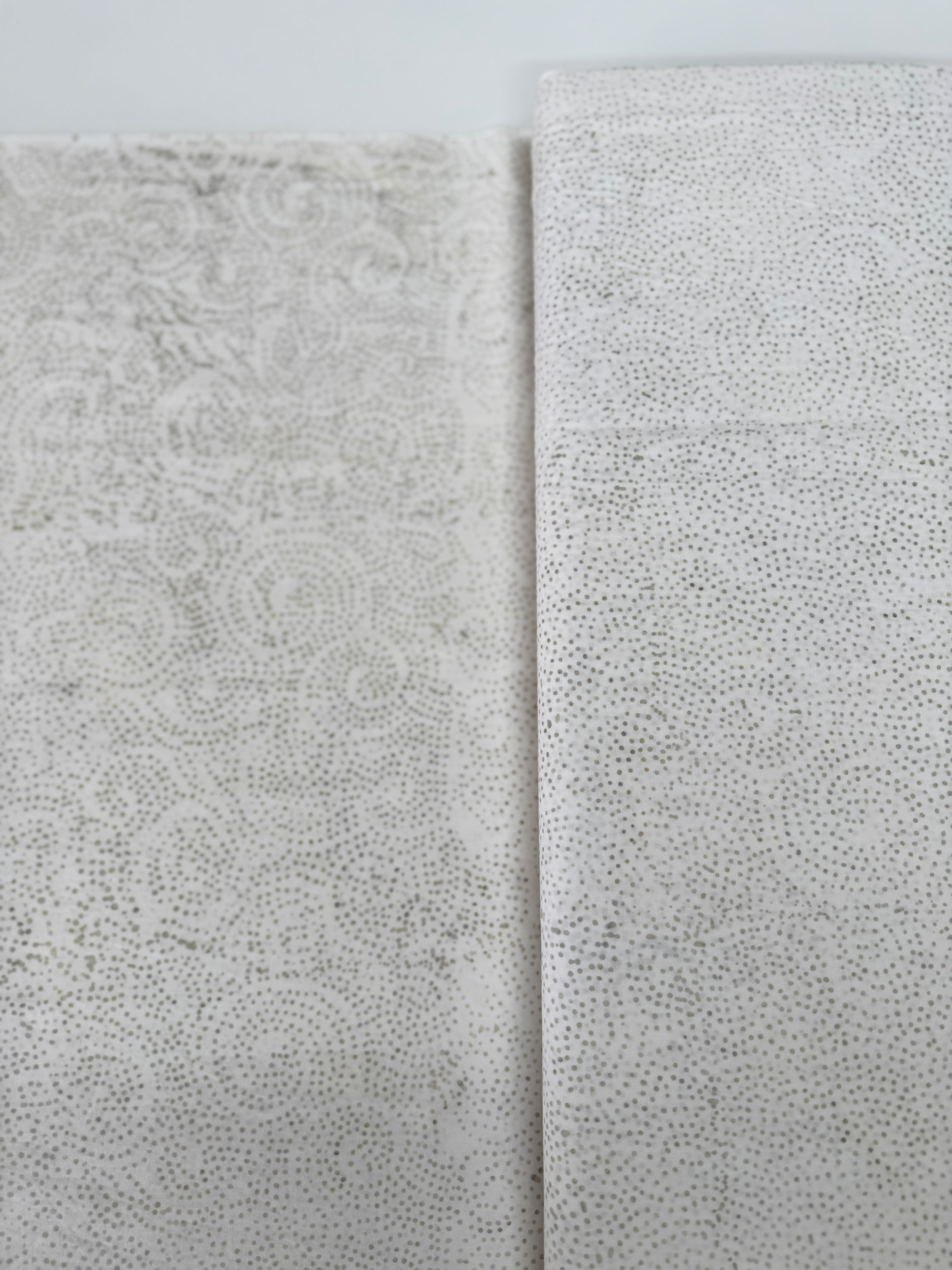 Tonga Stormy Sea Cosmic Sky Bone hand‑dyed cotton batik fabric by Wing and a Prayer for Timeless Treasures in neutral ombre tones.