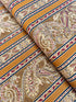 Delhi - Border Golden fabric by Jinny Beyer for RJR Fabrics with ornate Indian-style border design in rich golden tones on 100% cotton.
