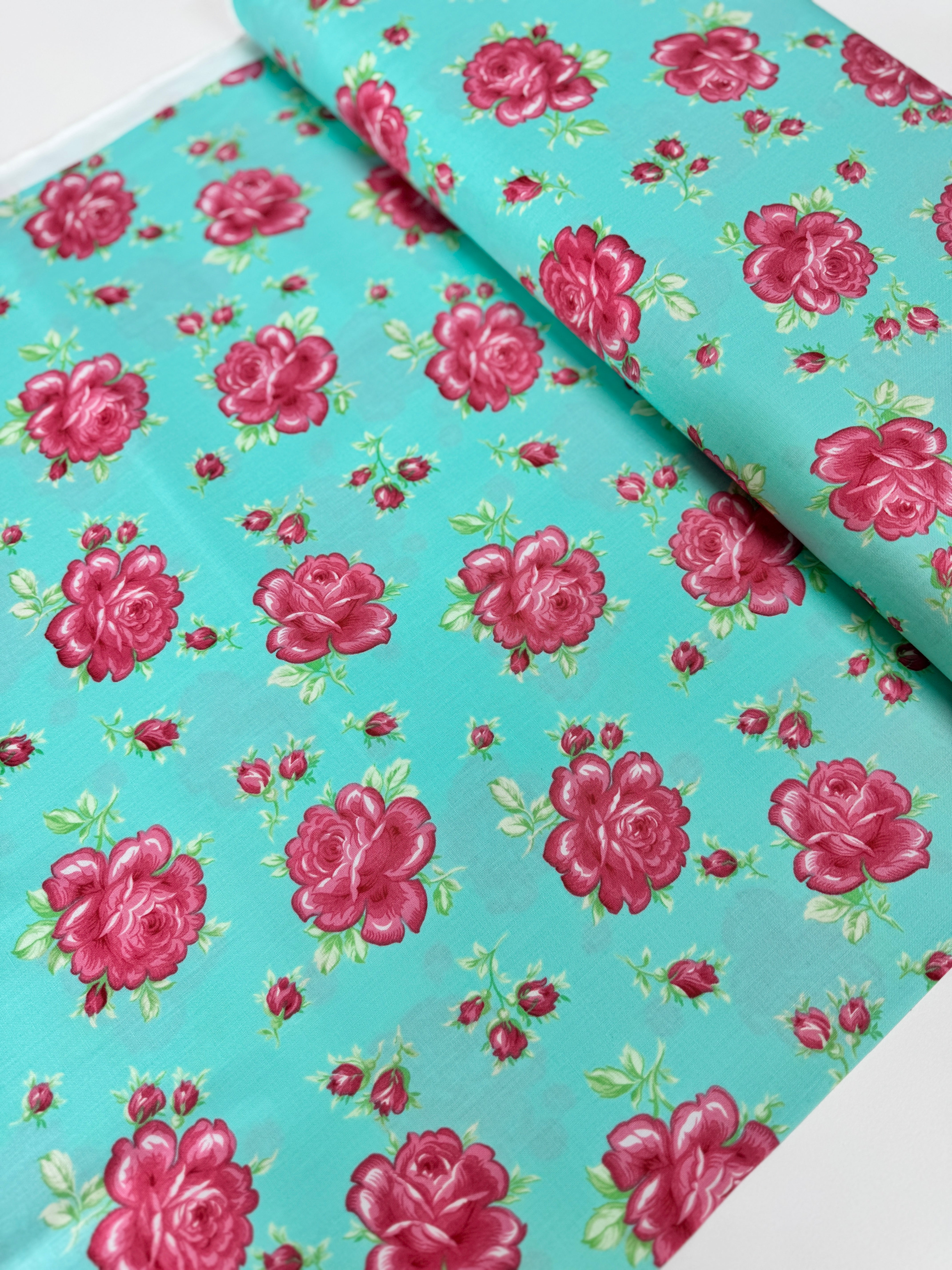 Sugar Bloom Icing Rose Aqua quilting cotton by Verna Mosquera for Free Spirit Fabrics – pink rose design on aqua background, 43″ wide