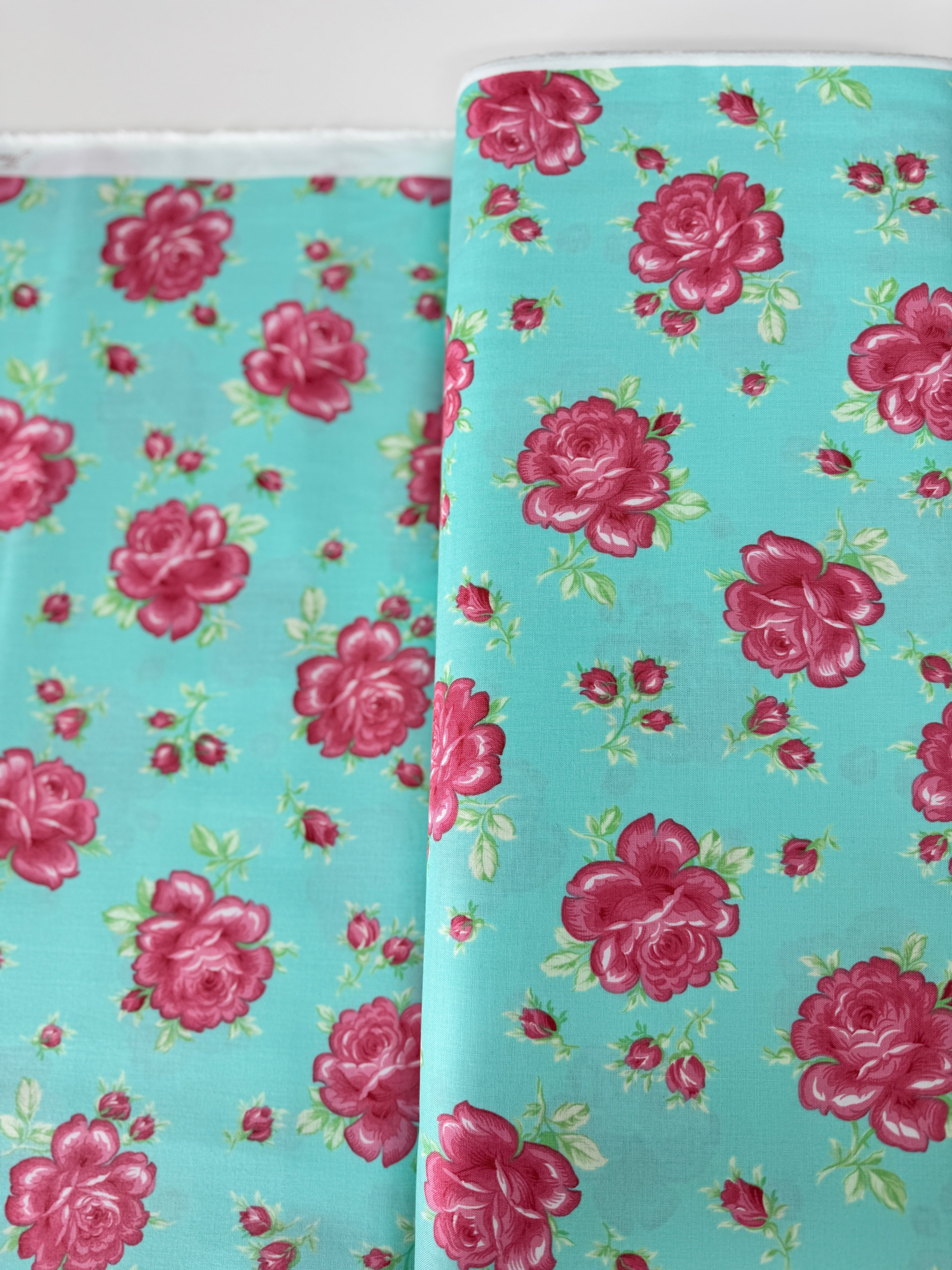 Sugar Bloom Icing Rose Aqua quilting cotton by Verna Mosquera for Free Spirit Fabrics – pink rose design on aqua background, 43″ wide