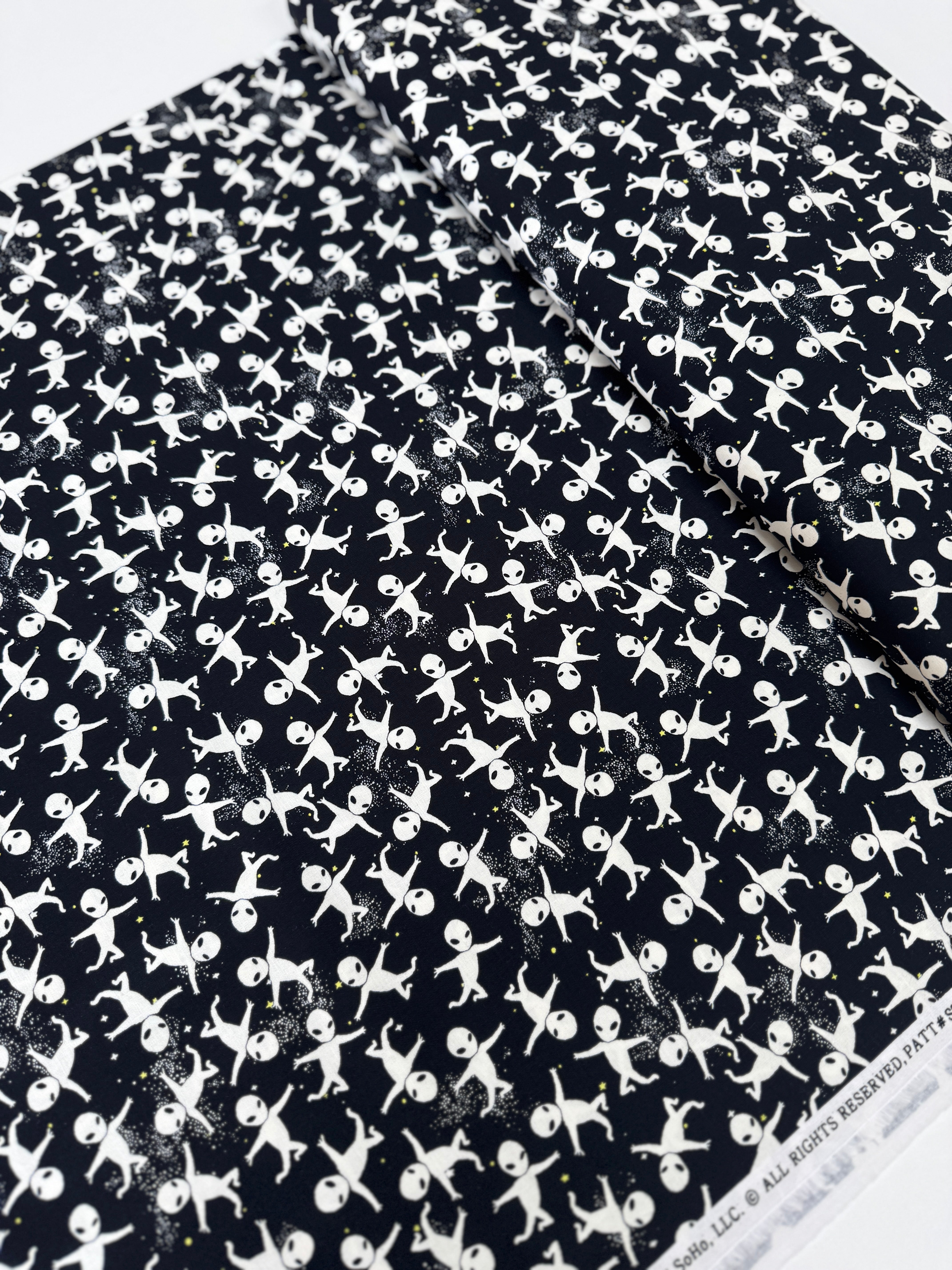 Aliens in Space glow-in-the-dark cotton fabric by Timeless Treasures – astronaut and alien motif on dark background