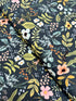 Amalfi Herb Garden Navy fabric by Rifle Paper Co. – bold floral print in pink, yellow, blue blooms with green leaves on navy background, 43″ wide