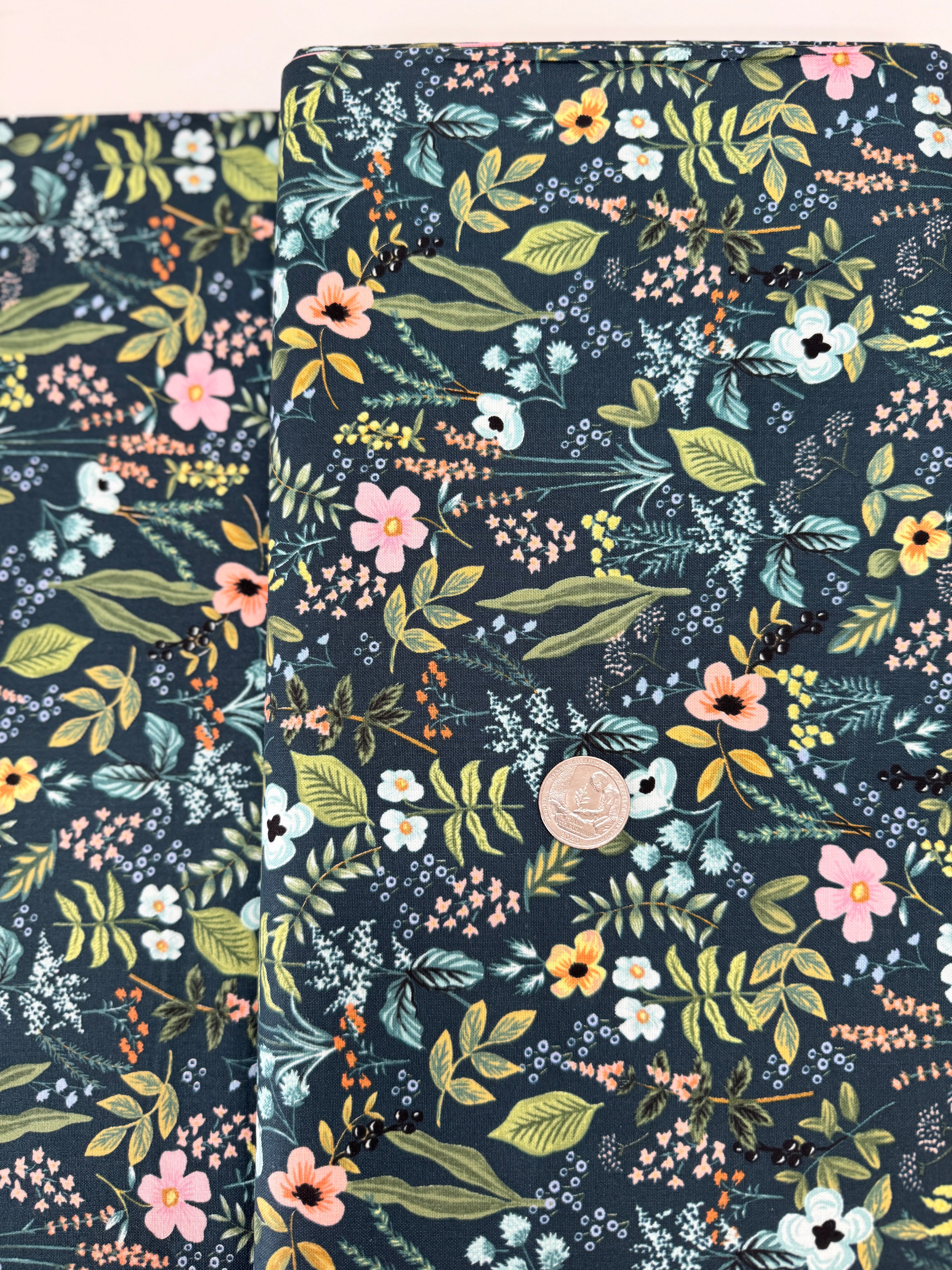 Amalfi Herb Garden Navy fabric by Rifle Paper Co. – bold floral print in pink, yellow, blue blooms with green leaves on navy background, 43″ wide