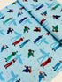 Frontline Heroes on Blue quilting cotton by Robert Kaufman – medical doctors and nurses motif on blue background, 43″ wide