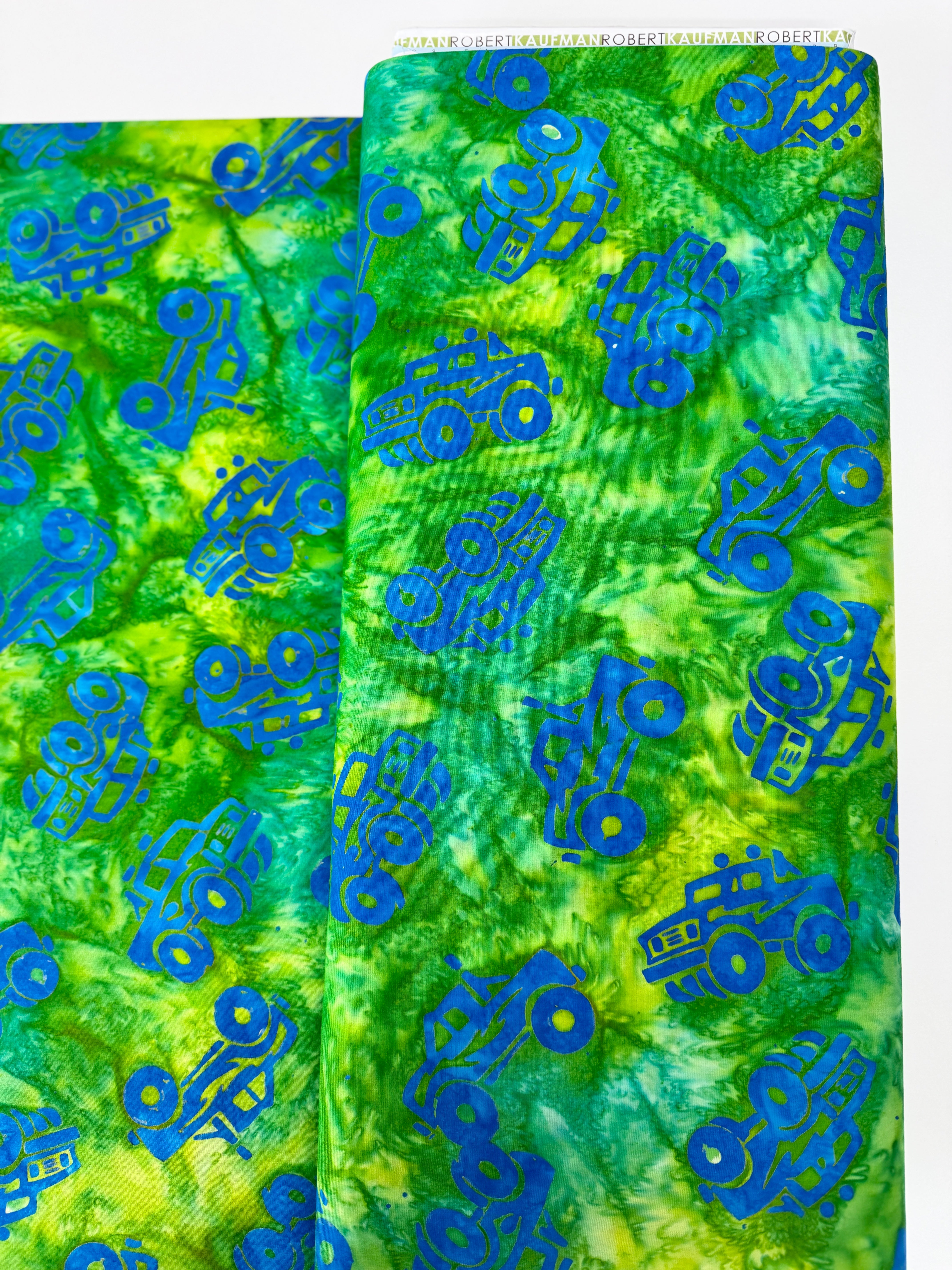 Trucks and Tracks batik fabric by Lunn Studios – vehicles motif on quilt‑weight cotton from Robert Kaufman