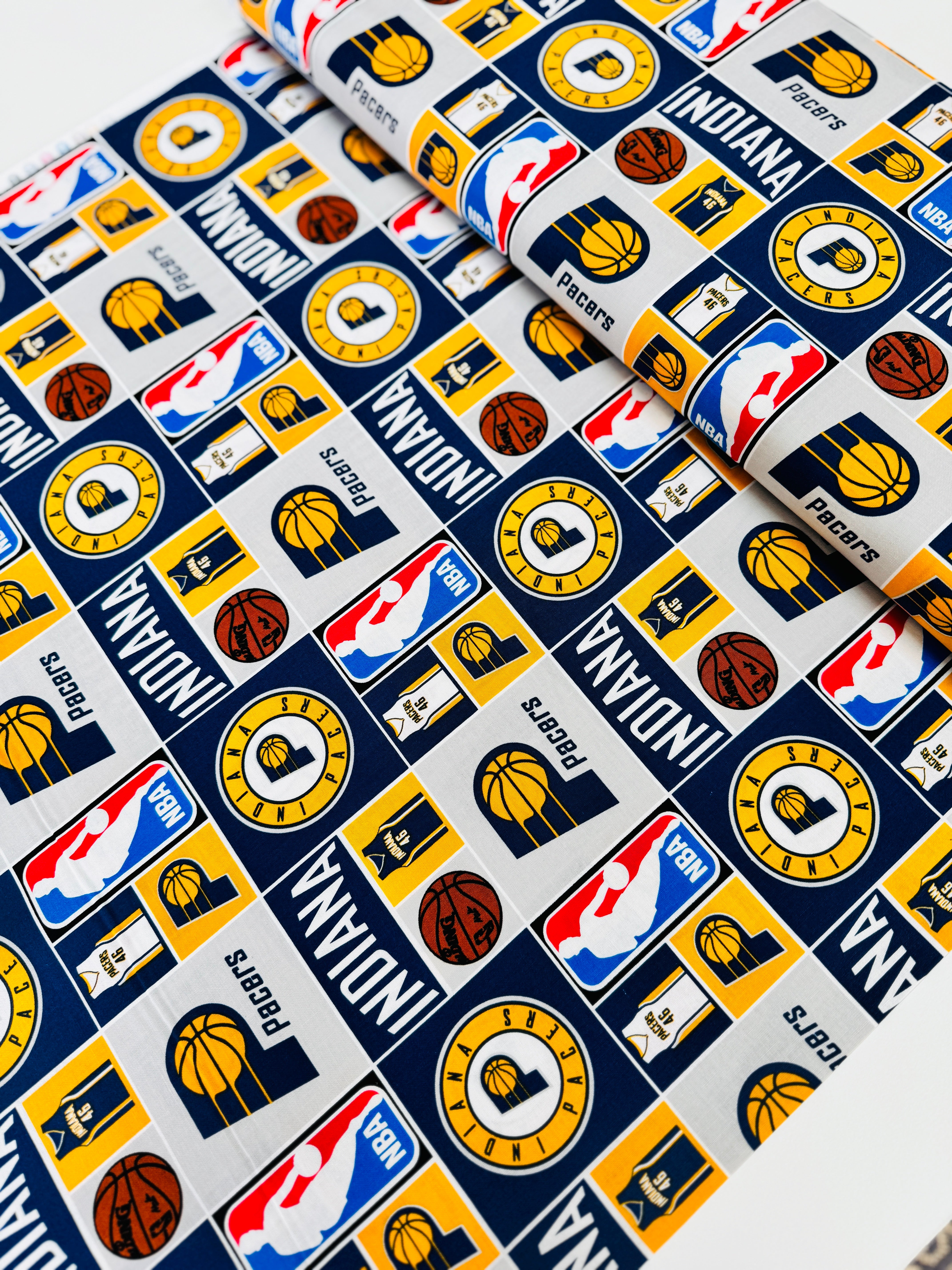 Licensed Indiana Pacers cotton fabric by Camelot Fabrics – 44" wide quilting cotton featuring Pacers logos and team colors