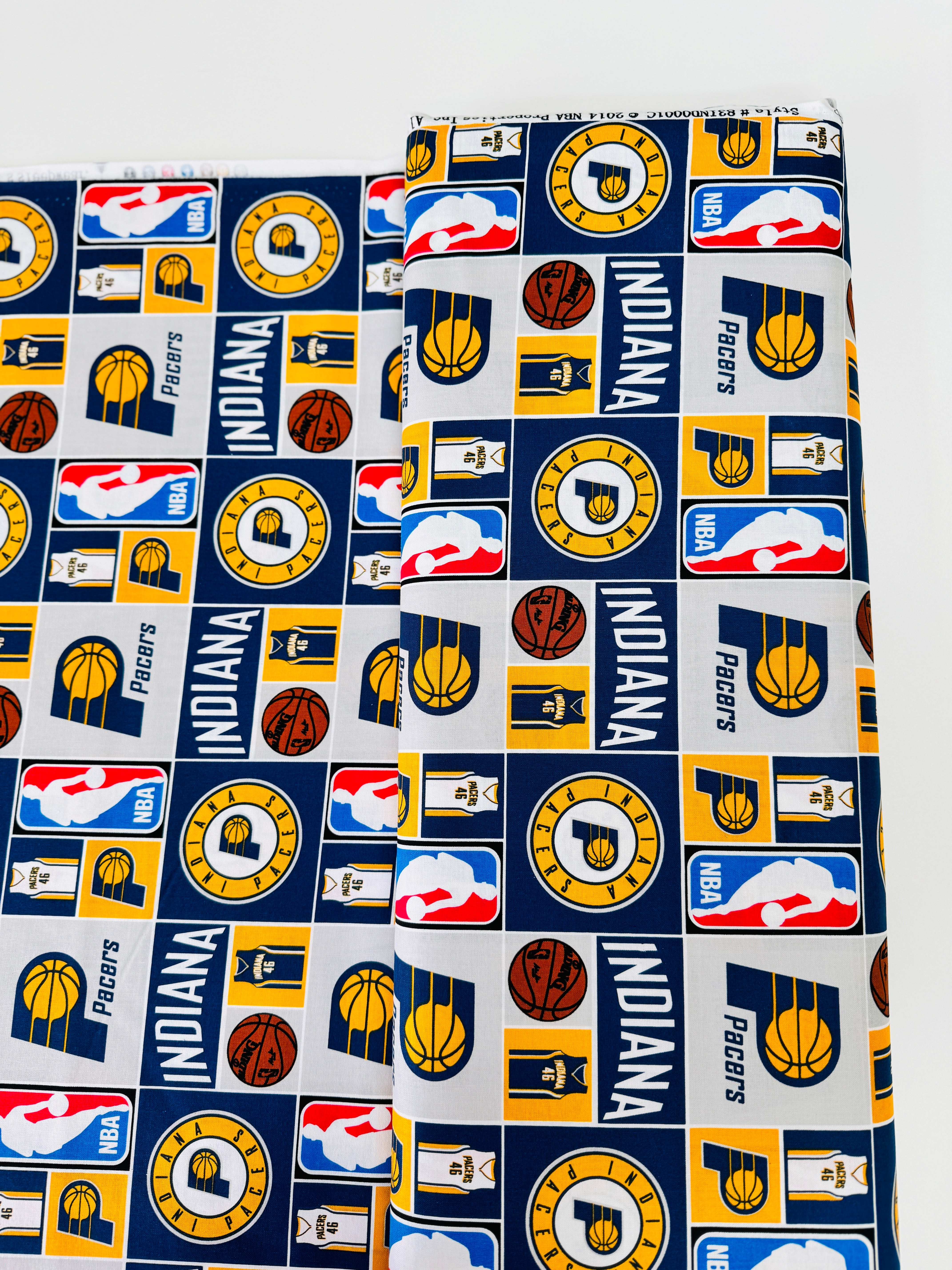 Licensed Indiana Pacers cotton fabric by Camelot Fabrics – 44" wide quilting cotton featuring Pacers logos and team colors