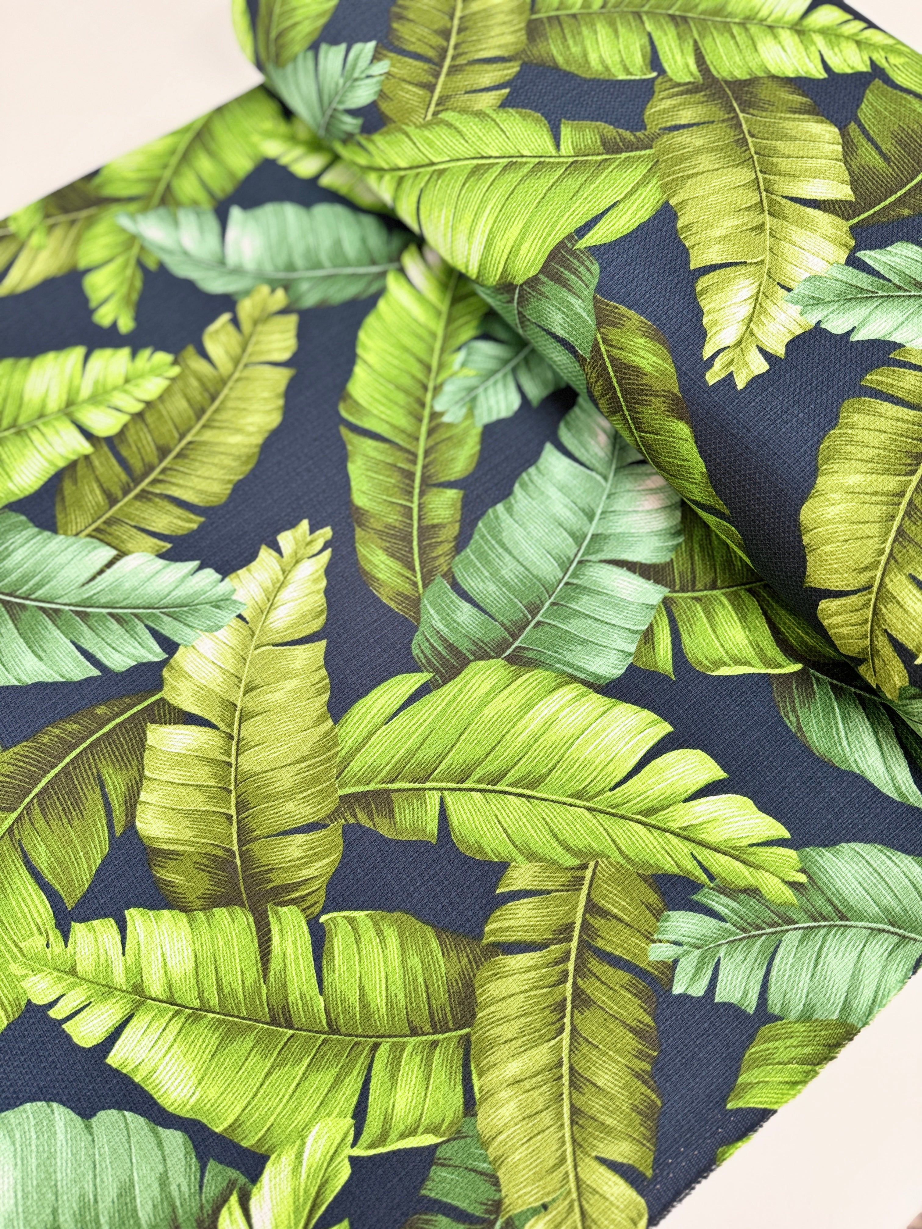 Sevenberry Island Paradise barkcloth fabric by Sevenberry for Robert Kaufman – navy background with tropical leaves; 90% cotton barkcloth