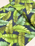 Sevenberry Island Paradise barkcloth fabric by Sevenberry for Robert Kaufman – navy background with tropical leaves; 90% cotton barkcloth