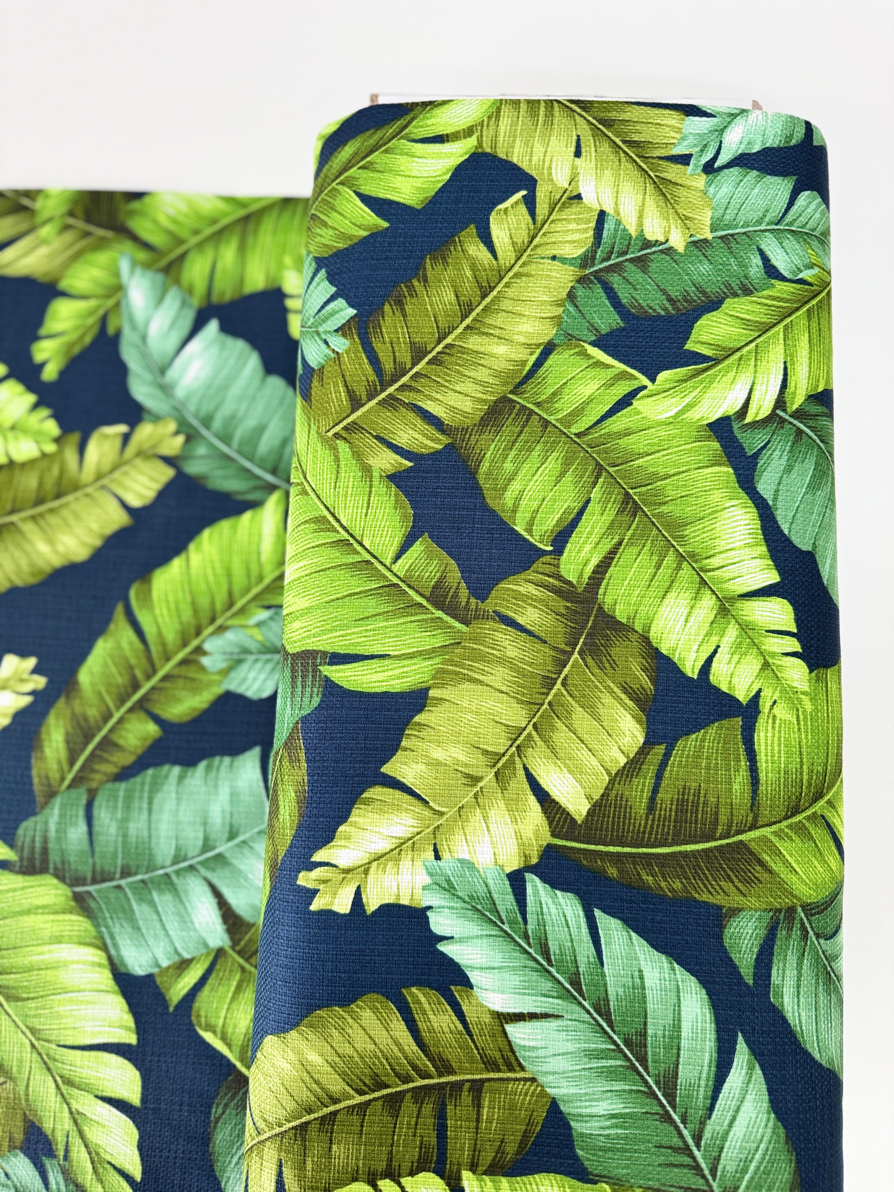 Sevenberry Island Paradise barkcloth fabric by Sevenberry for Robert Kaufman – navy background with tropical leaves; 90% cotton barkcloth