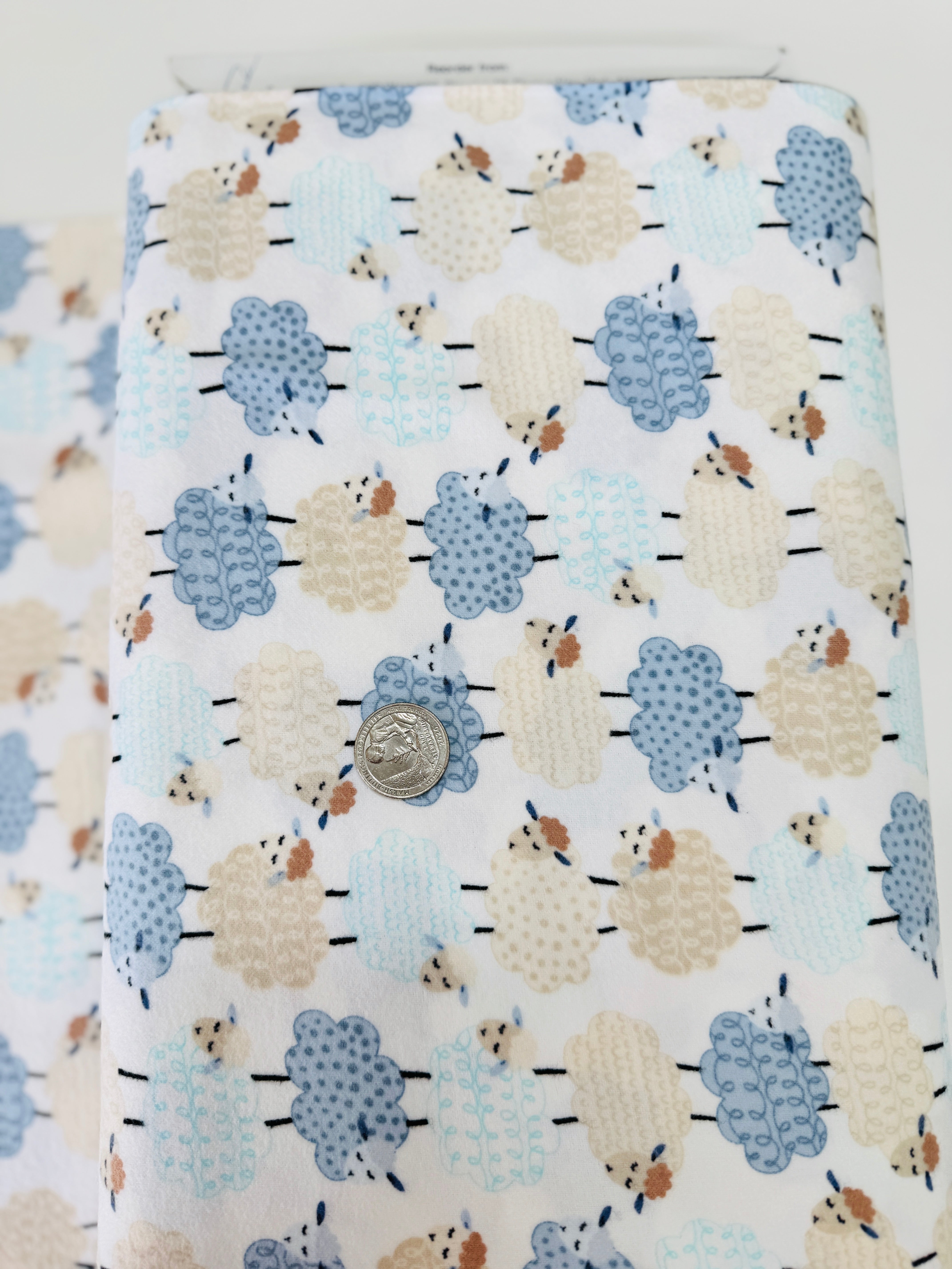 Sweet Dreams Flannel – White fabric with playful stacked sheep design by Kanvas Studio for Benartex, soft brushed cotton flannel.