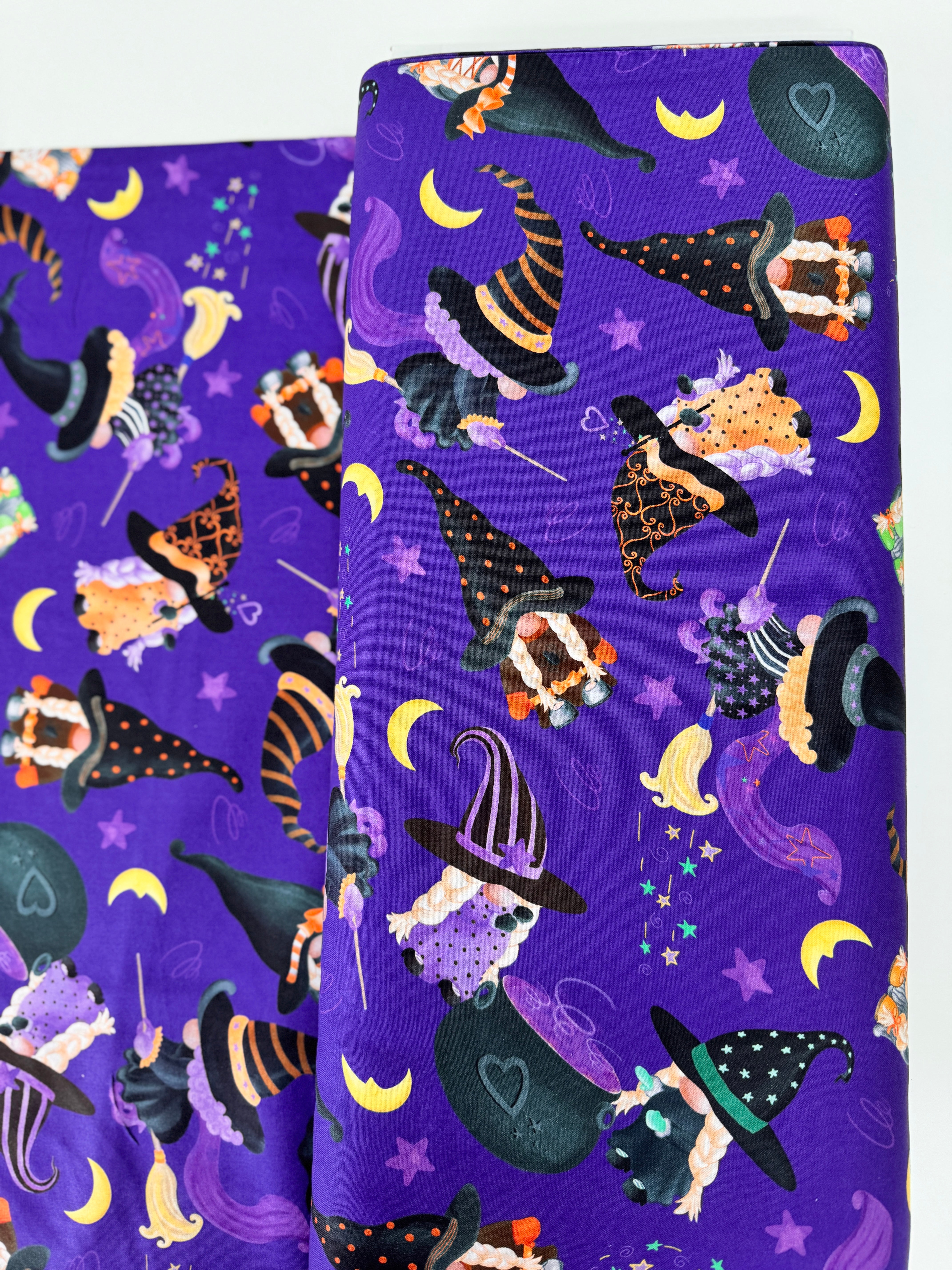 Spooktacular Gnomes fabric with purple background, Halloween gnomes, pumpkins, and stars – 12796-66 by Andi Metz for Kanvas Studio.