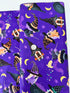 Spooktacular Gnomes fabric with purple background, Halloween gnomes, pumpkins, and stars – 12796-66 by Andi Metz for Kanvas Studio.