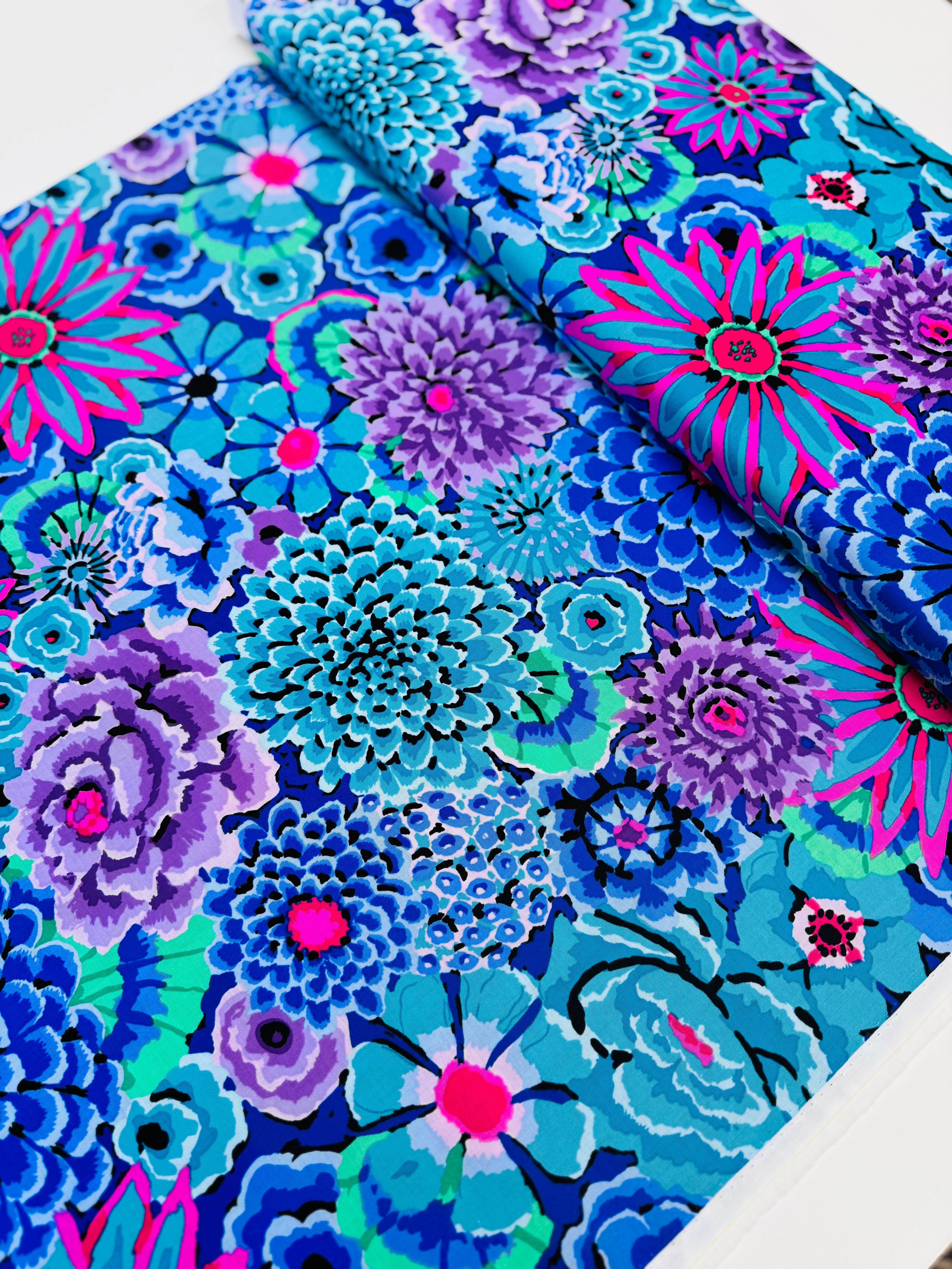 Enchanted Blue quilting cotton by Philip Jacobs for the Kaffe Fassett Collective – bold blue floral print on cotton fabric