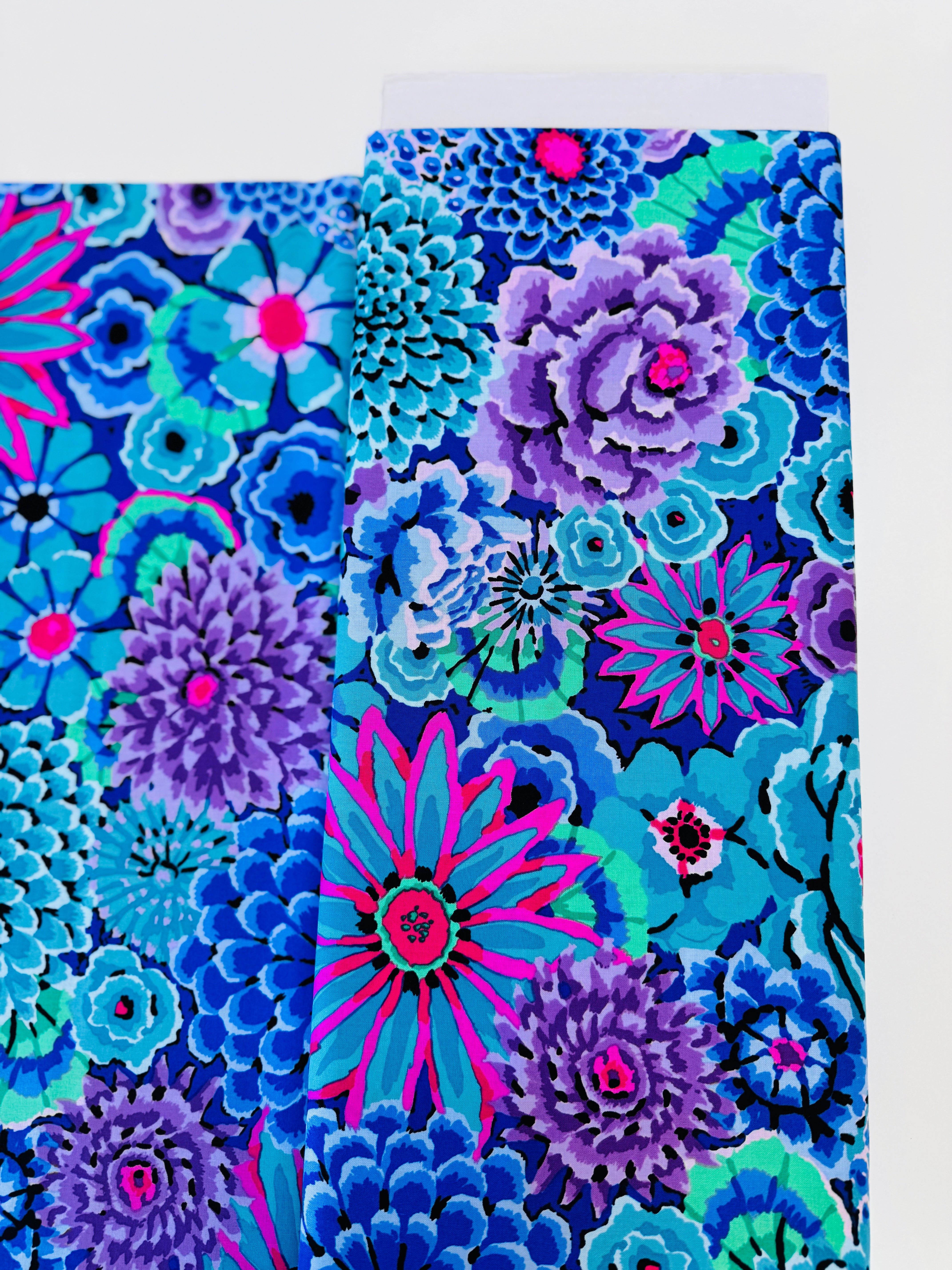 Enchanted Blue quilting cotton by Philip Jacobs for the Kaffe Fassett Collective – bold blue floral print on cotton fabric