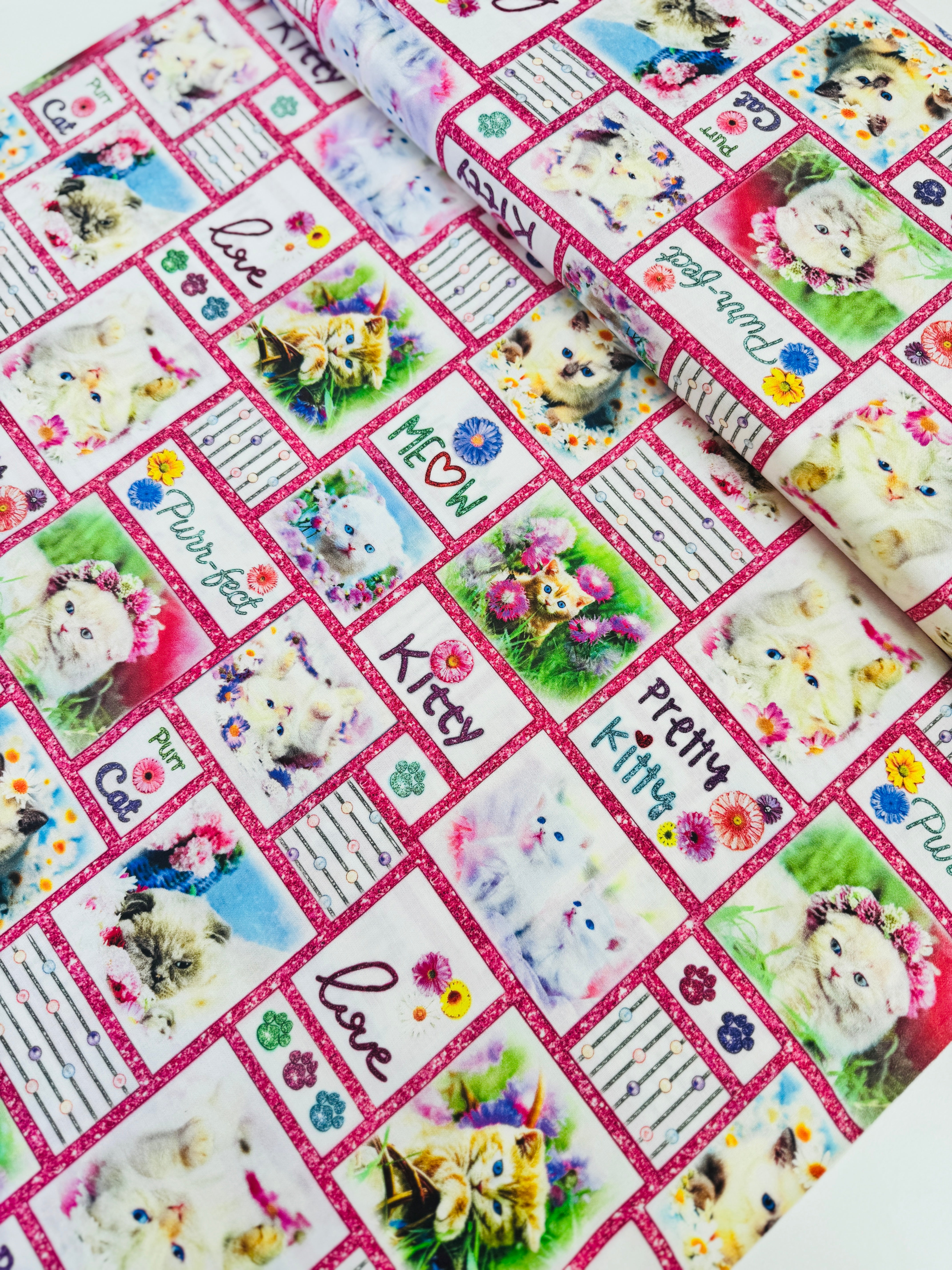 Kitty Patchwork quilting cotton by Studio E Fabrics – cat patch print with various kittens and paws on cotton background, 43" wide