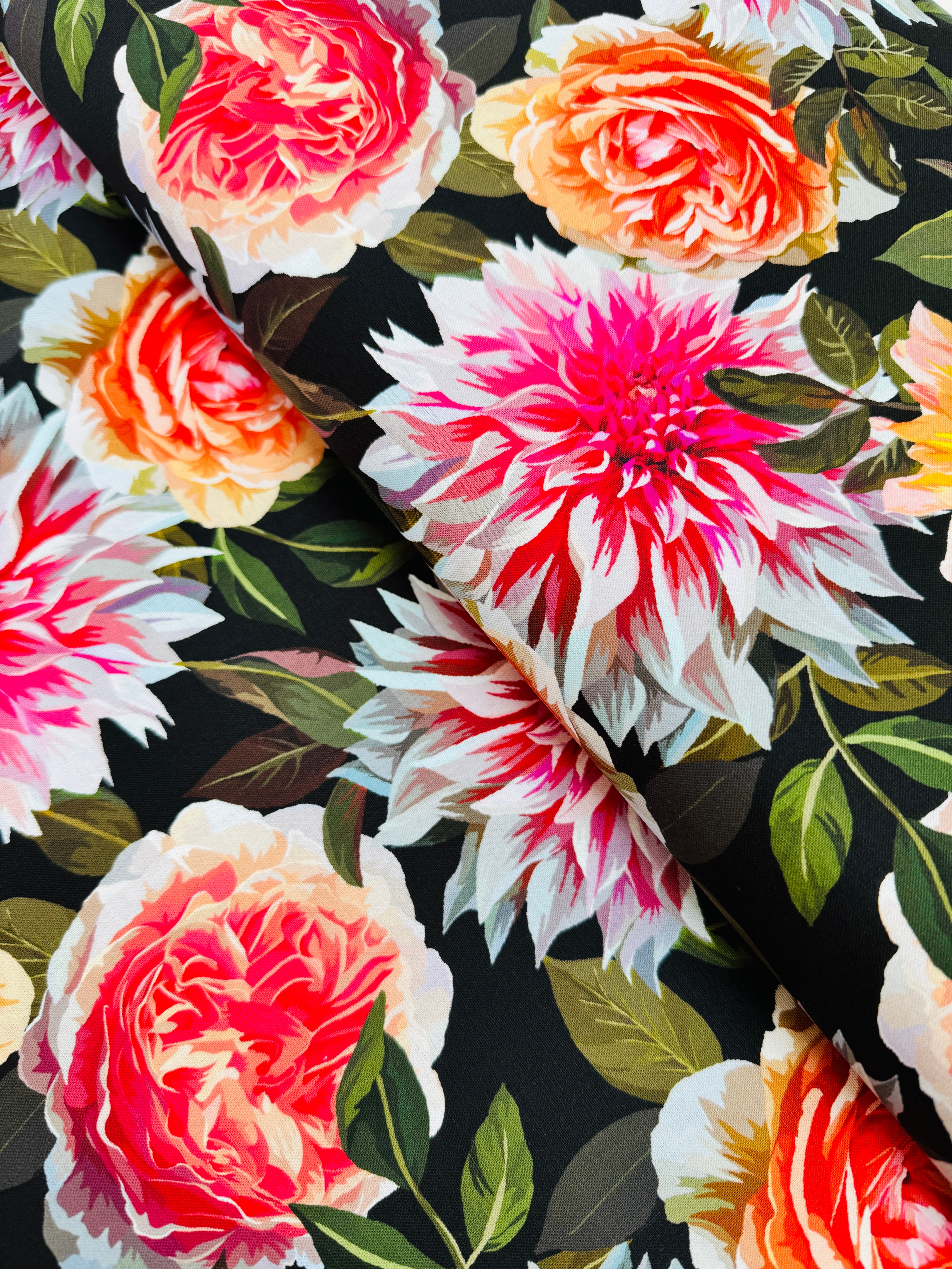 Enchanted Field Dreaming of Dahlias Pink Glow quilting cotton by RJR Studio – vibrant pink and peach dahlias on black background, 43–44″ wide