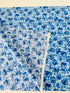 Garden Blues Sky quilting cotton by Sevenberry for Robert Kaufman – delicate blue blossoms on light sky‑blue background, 43–44″ wide