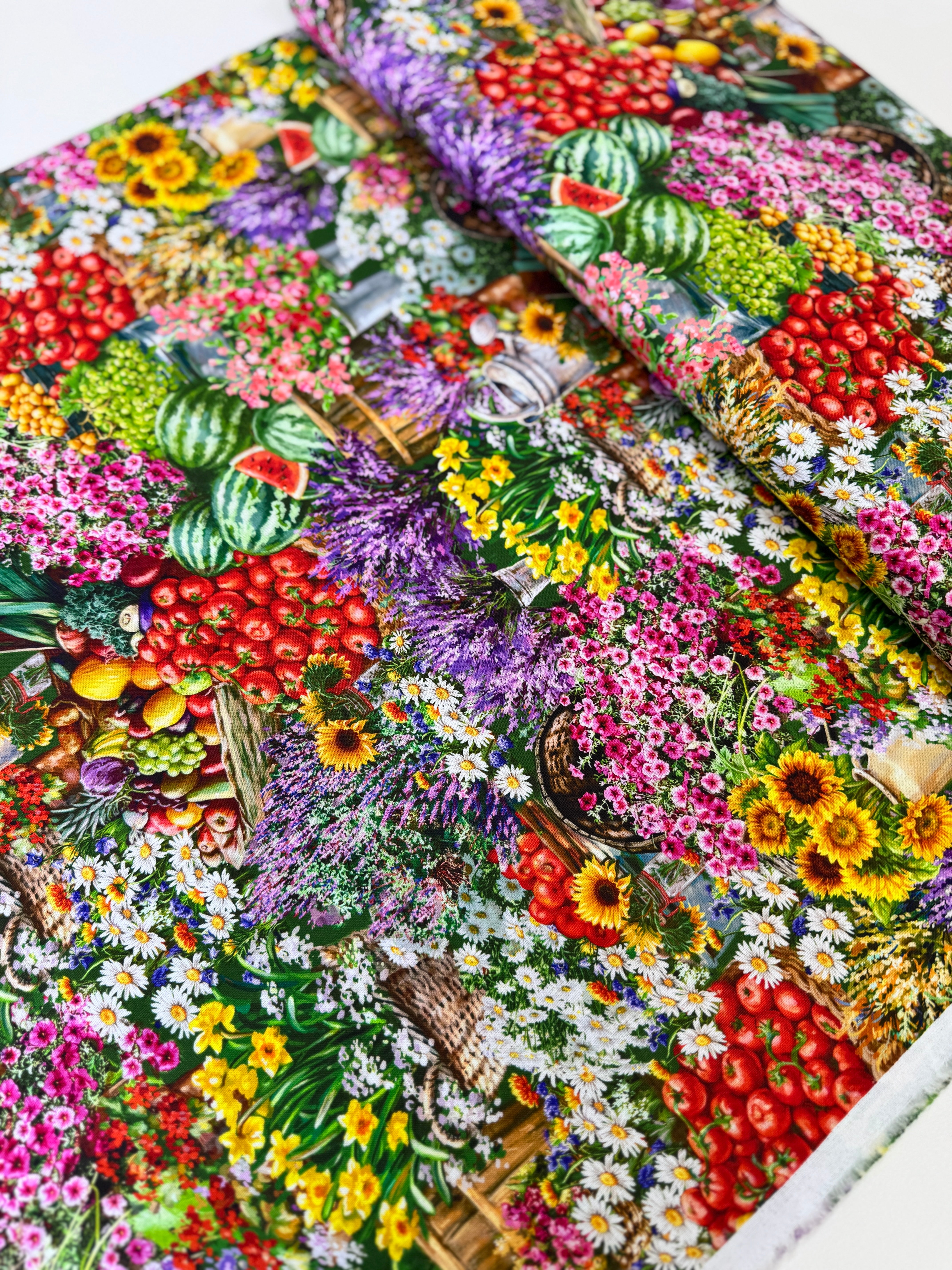Farm Stand quilting cotton by Dona Gelsinger for Timeless Treasures – colorful produce, flowers, and garden tools on a green background, 43/44″ wide