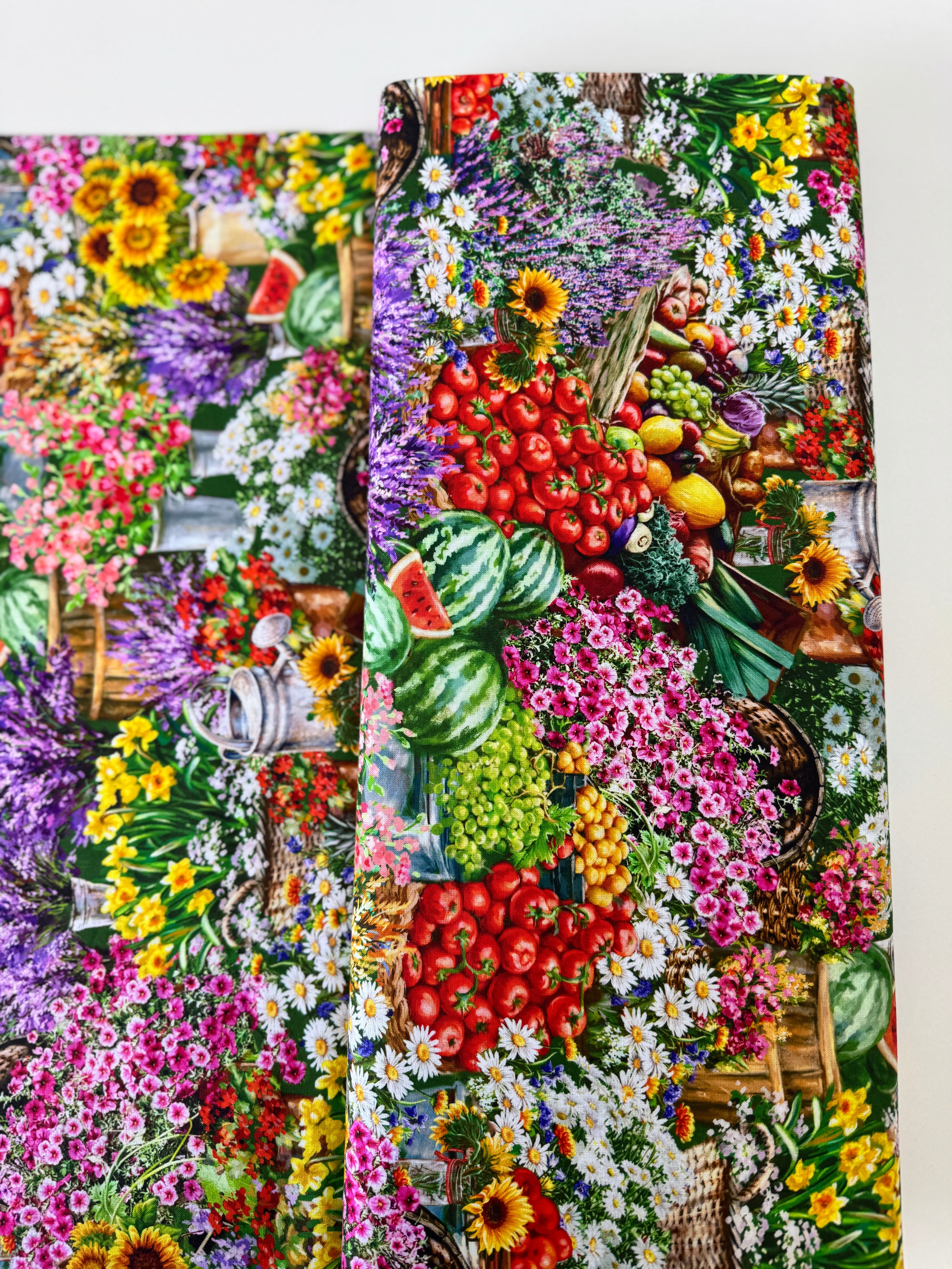 Farm Stand quilting cotton by Dona Gelsinger for Timeless Treasures – colorful produce, flowers, and garden tools on a green background, 43/44″ wide