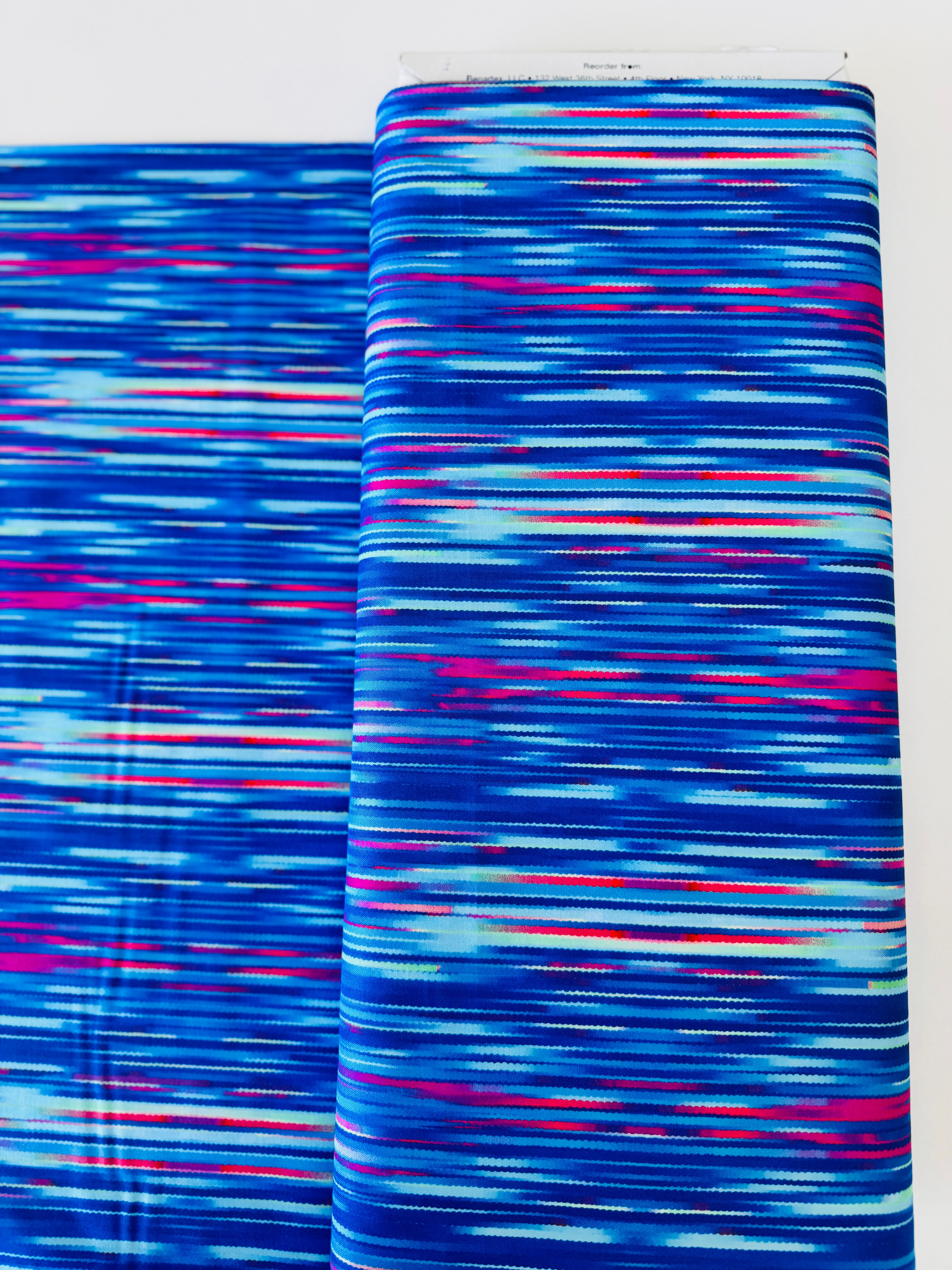 Luminous Blooms Cobalt Blue brushstroke pattern on cotton by Kanvas Studio for Benartex – vibrant blue with pink and red streaks