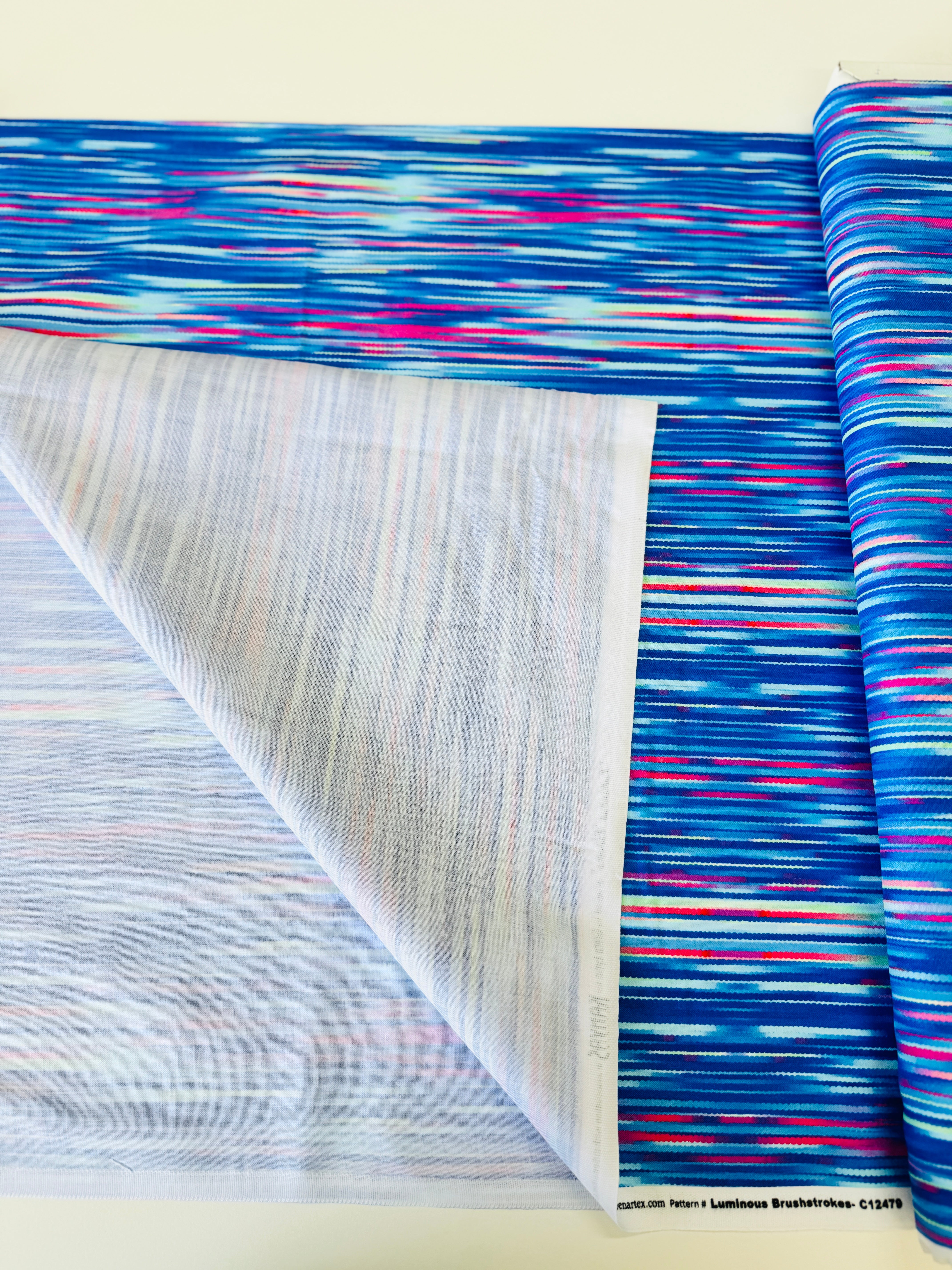 Luminous Blooms Cobalt Blue brushstroke pattern on cotton by Kanvas Studio for Benartex – vibrant blue with pink and red streaks