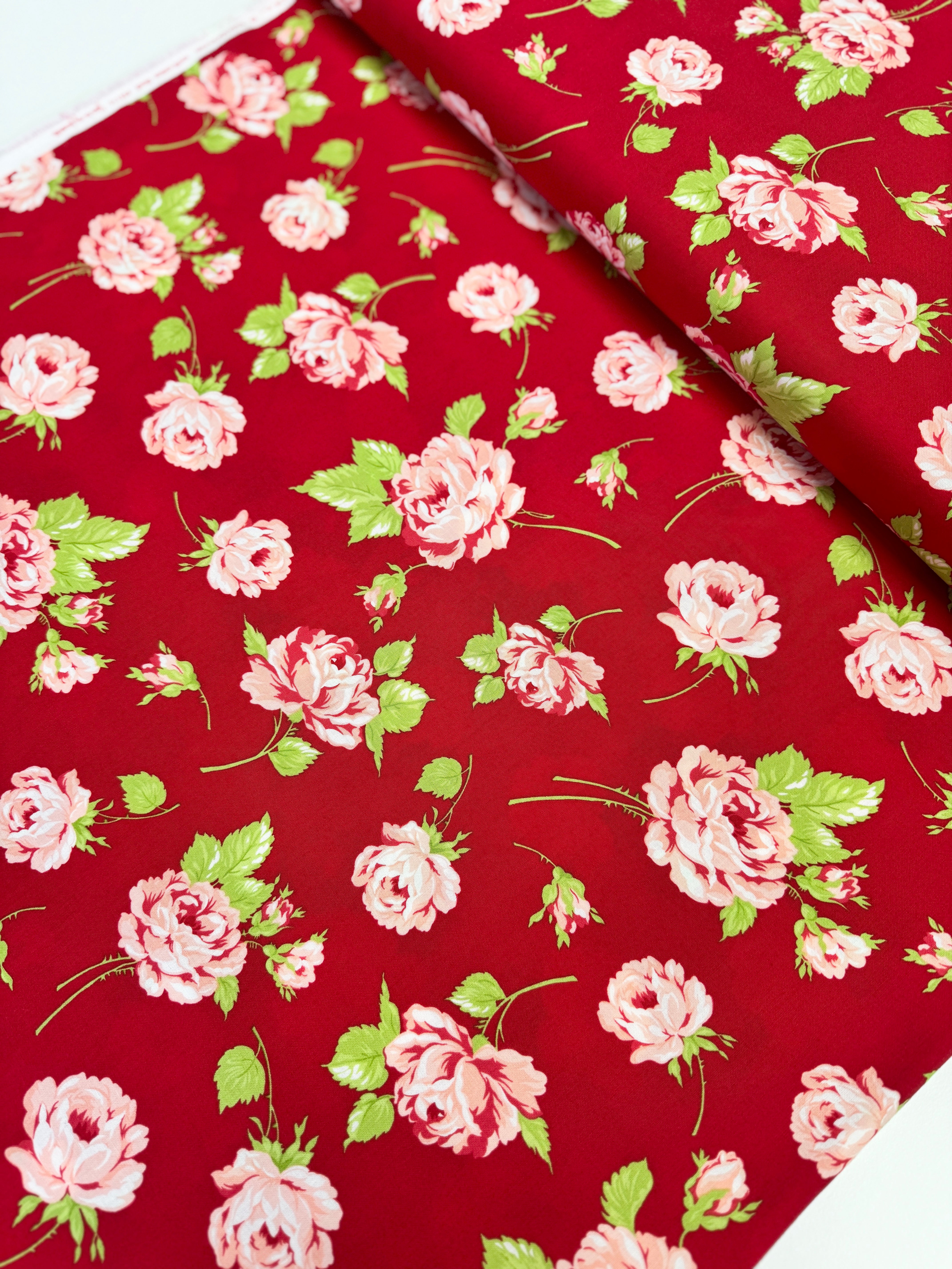 Smitten – Rosy Red floral fabric by Bonnie & Camille for Moda featuring vintage-style red florals on a soft cotton background.