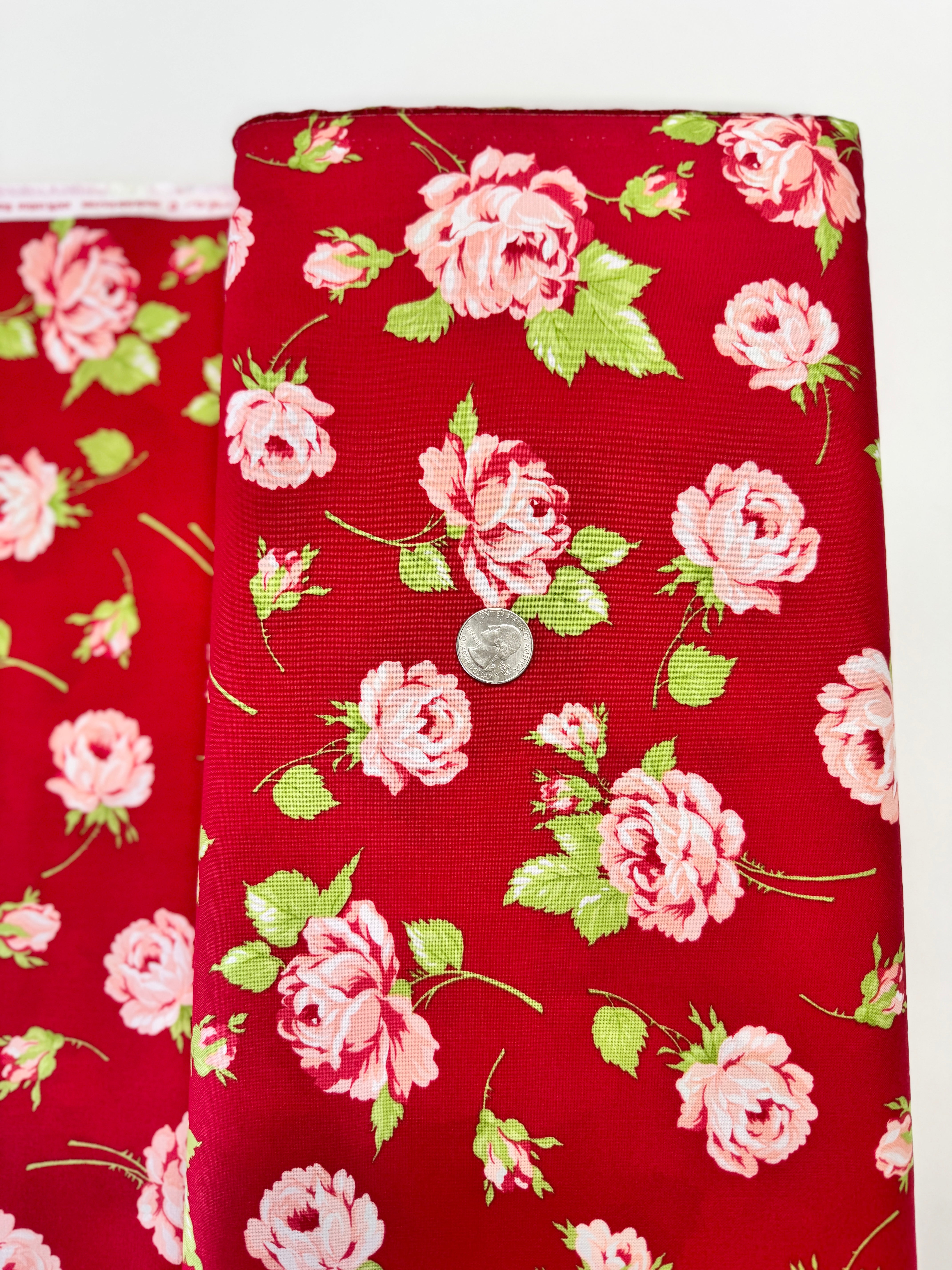 Smitten – Rosy Red floral fabric by Bonnie & Camille for Moda featuring vintage-style red florals on a soft cotton background.