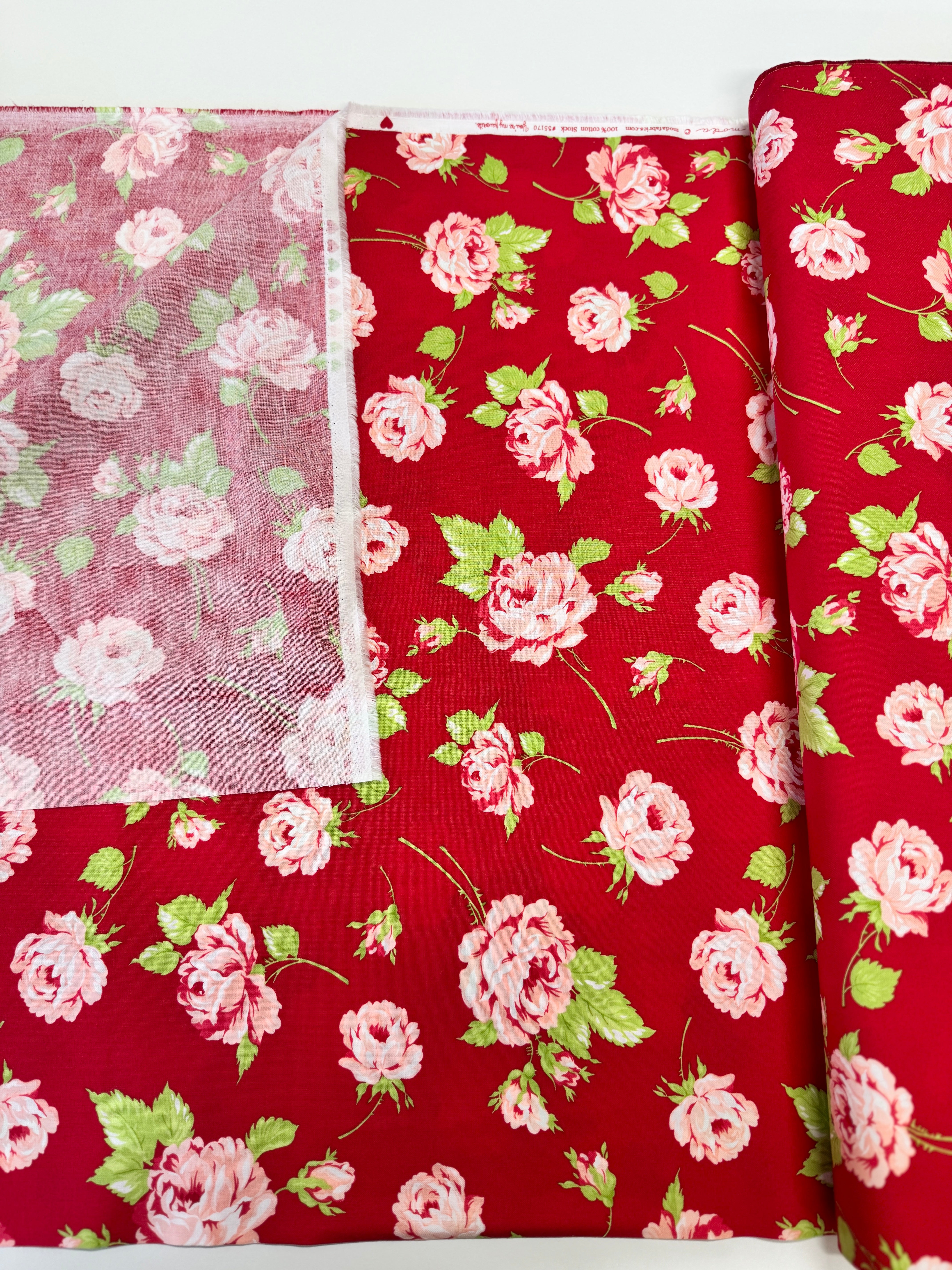 Smitten – Rosy Red floral fabric by Bonnie & Camille for Moda featuring vintage-style red florals on a soft cotton background.