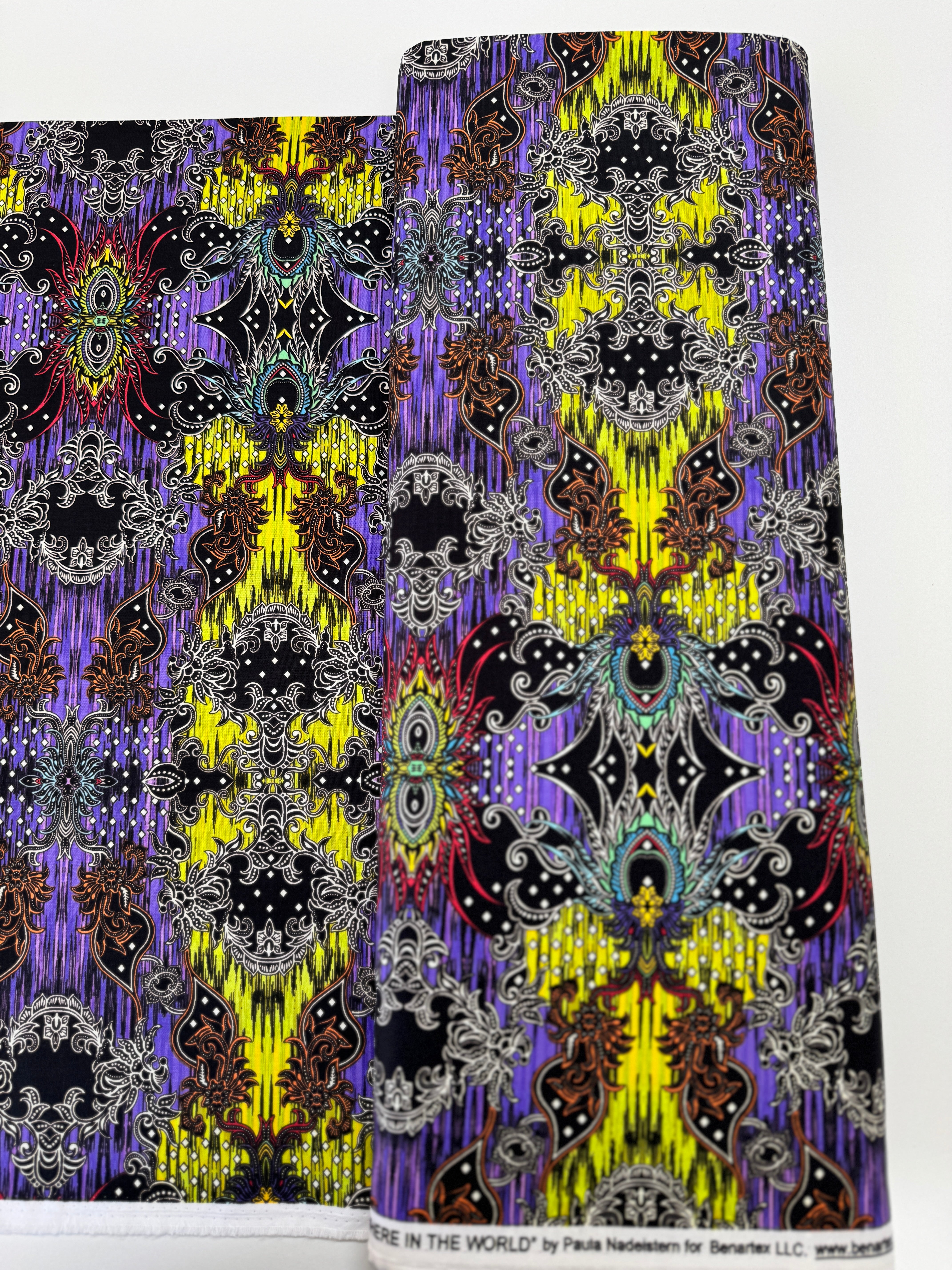 Close-up of Where in the World – Bali Green/Multi fabric by Paula Nadelstern for Benartex, digitally printed with intricate medallions.