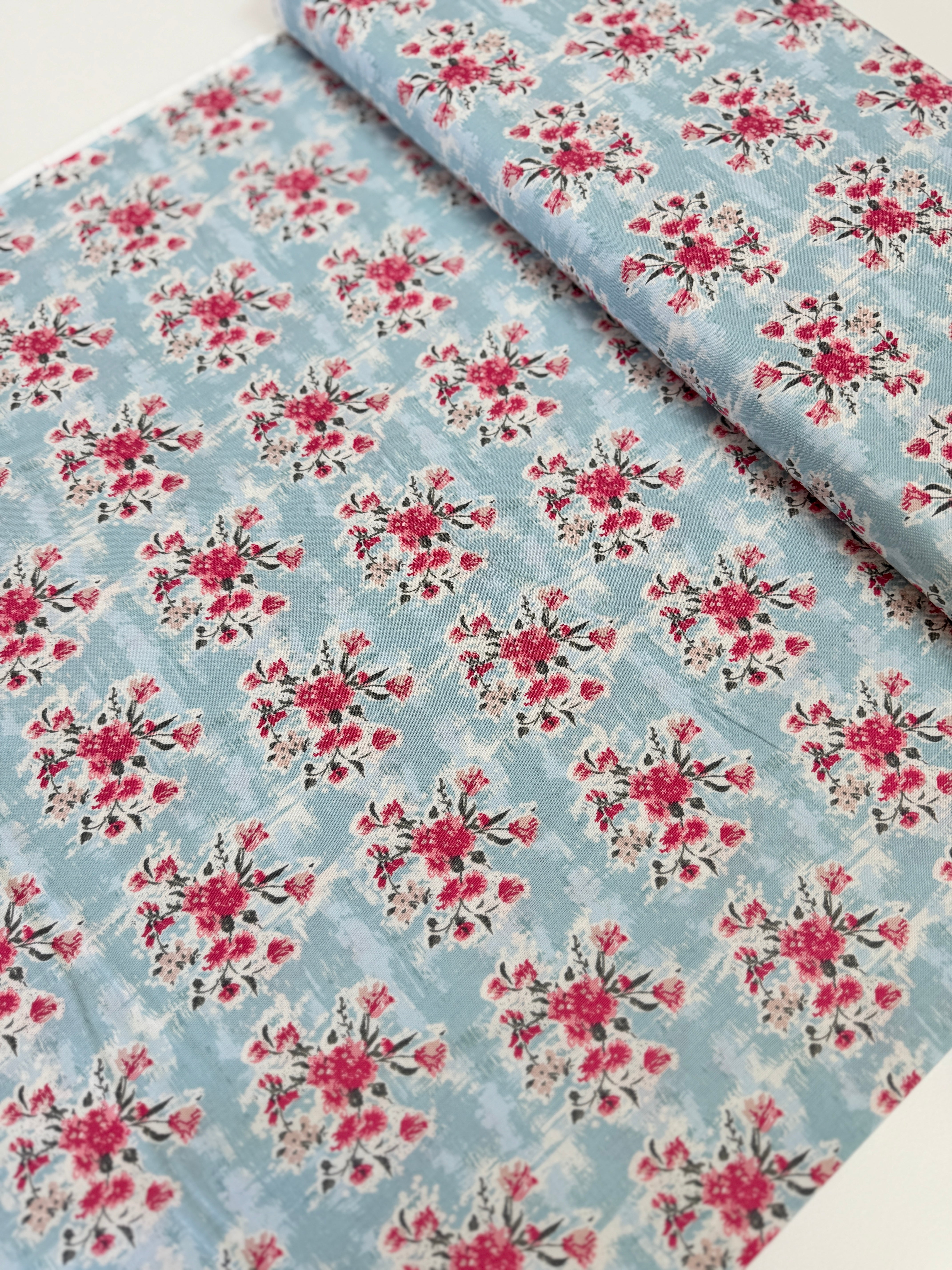 Abbie Floral Aqua Fabric by Sue Daley Designs for Riley Blake – Aqua background with red and white floral print