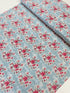 Abbie Floral Aqua Fabric by Sue Daley Designs for Riley Blake – Aqua background with red and white floral print