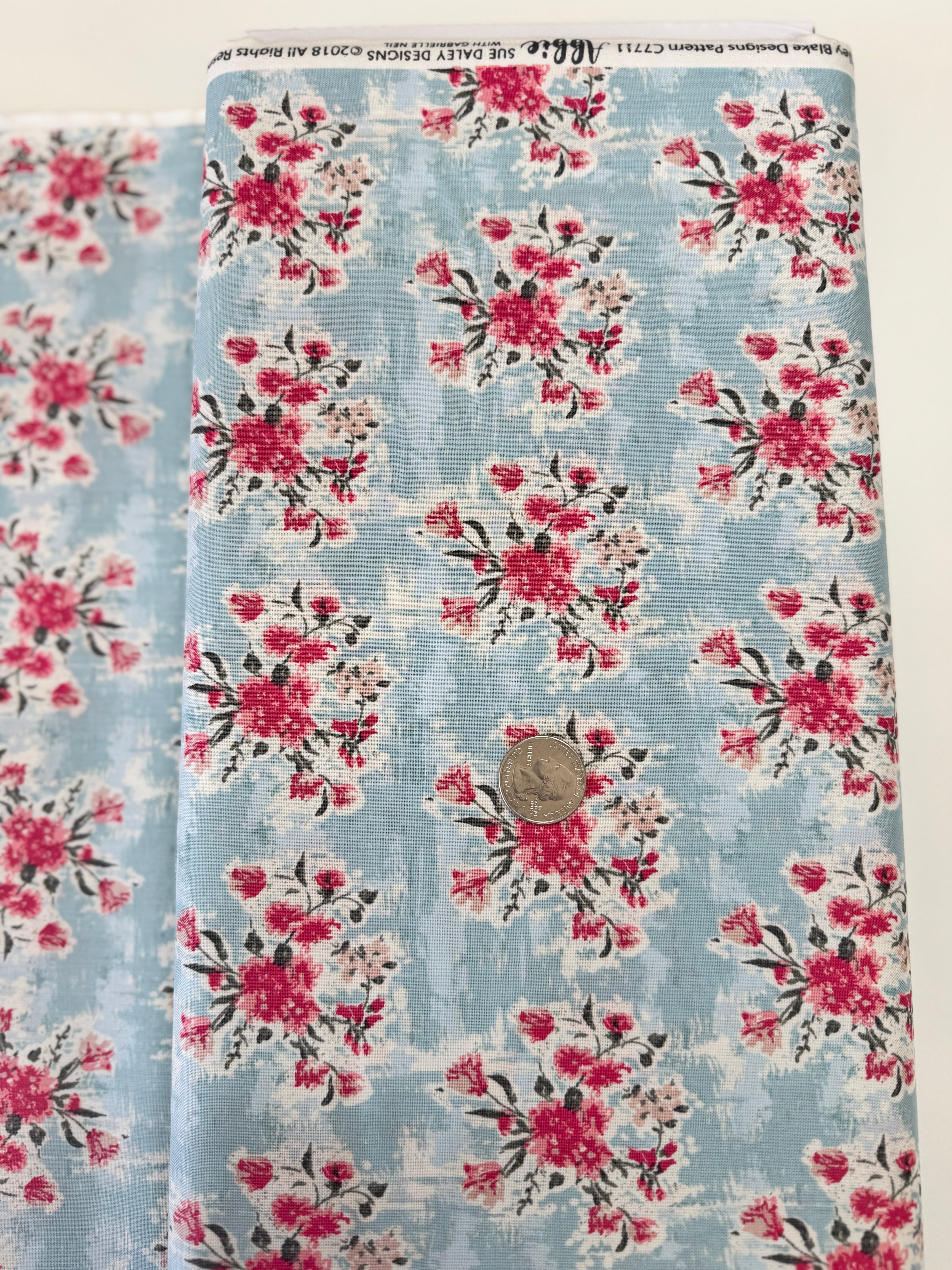 Abbie Floral Aqua Fabric by Sue Daley Designs for Riley Blake – Aqua background with red and white floral print
