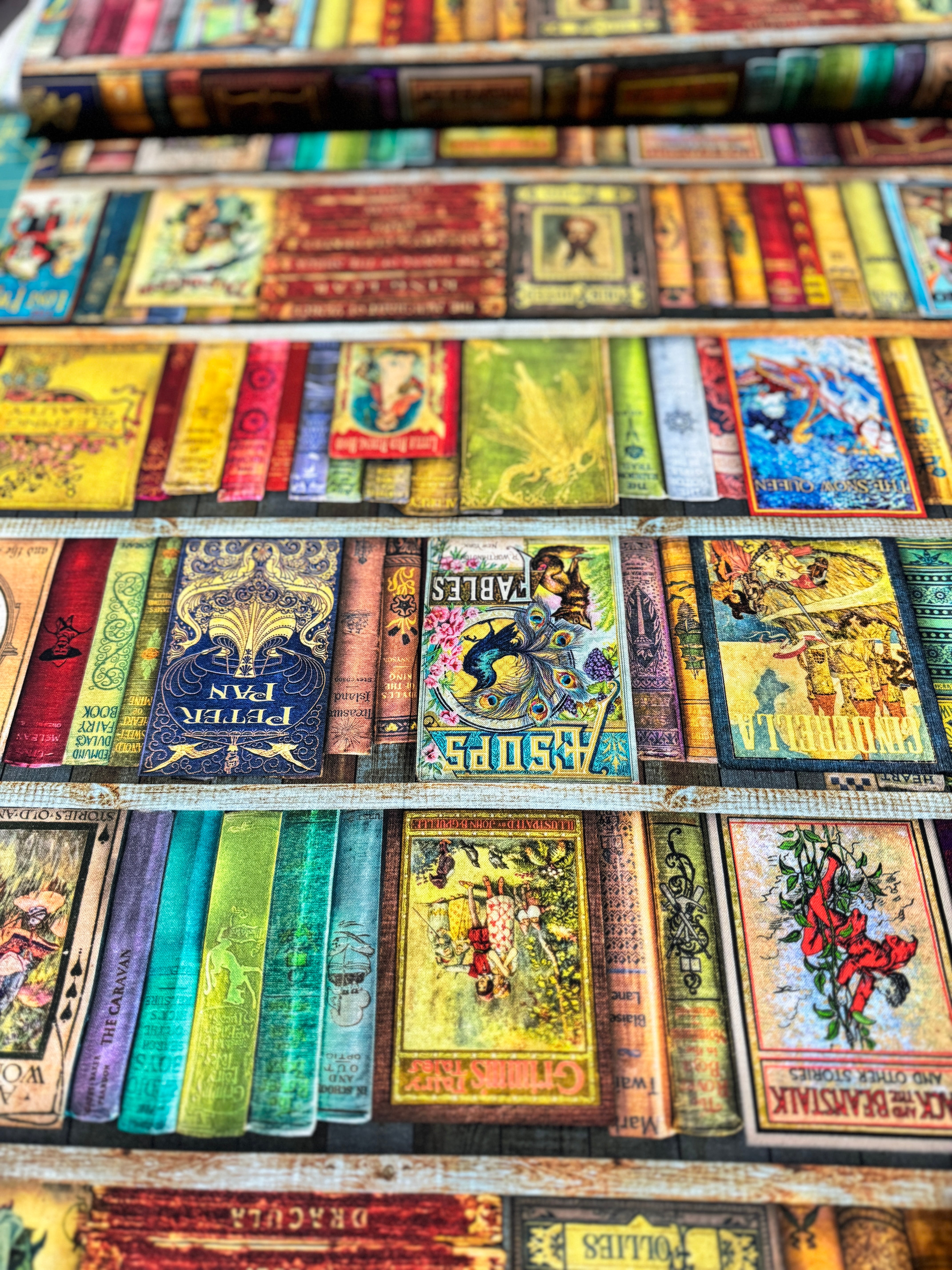 Library of Rarities Books Antique fabric by Aimee Stewart for Robert Kaufman featuring vintage bookshelves filled with beautifully illustrated classic storybooks and antique book spines, perfect for quilts, book sleeves, library décor, and literary sewing projects.