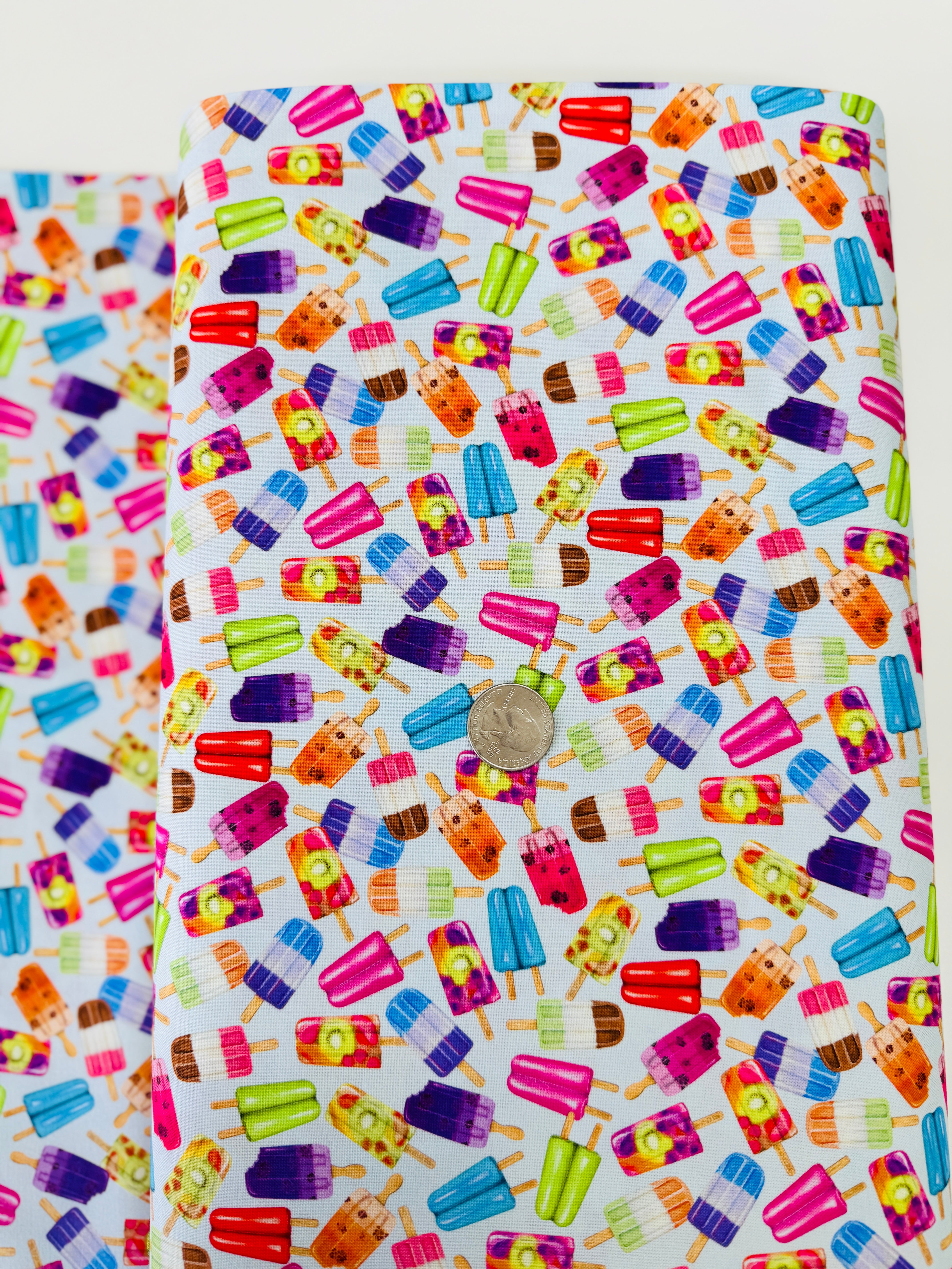 Sweet Tooth Popsicles on Blue fabric by Mary Lake Thompson for Robert Kaufman – colorful 100% cotton quilting fabric.