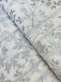 First Snowfall fabric with silver metallic leaves on white background by Hoffman Fabrics – quilting and holiday cotton.