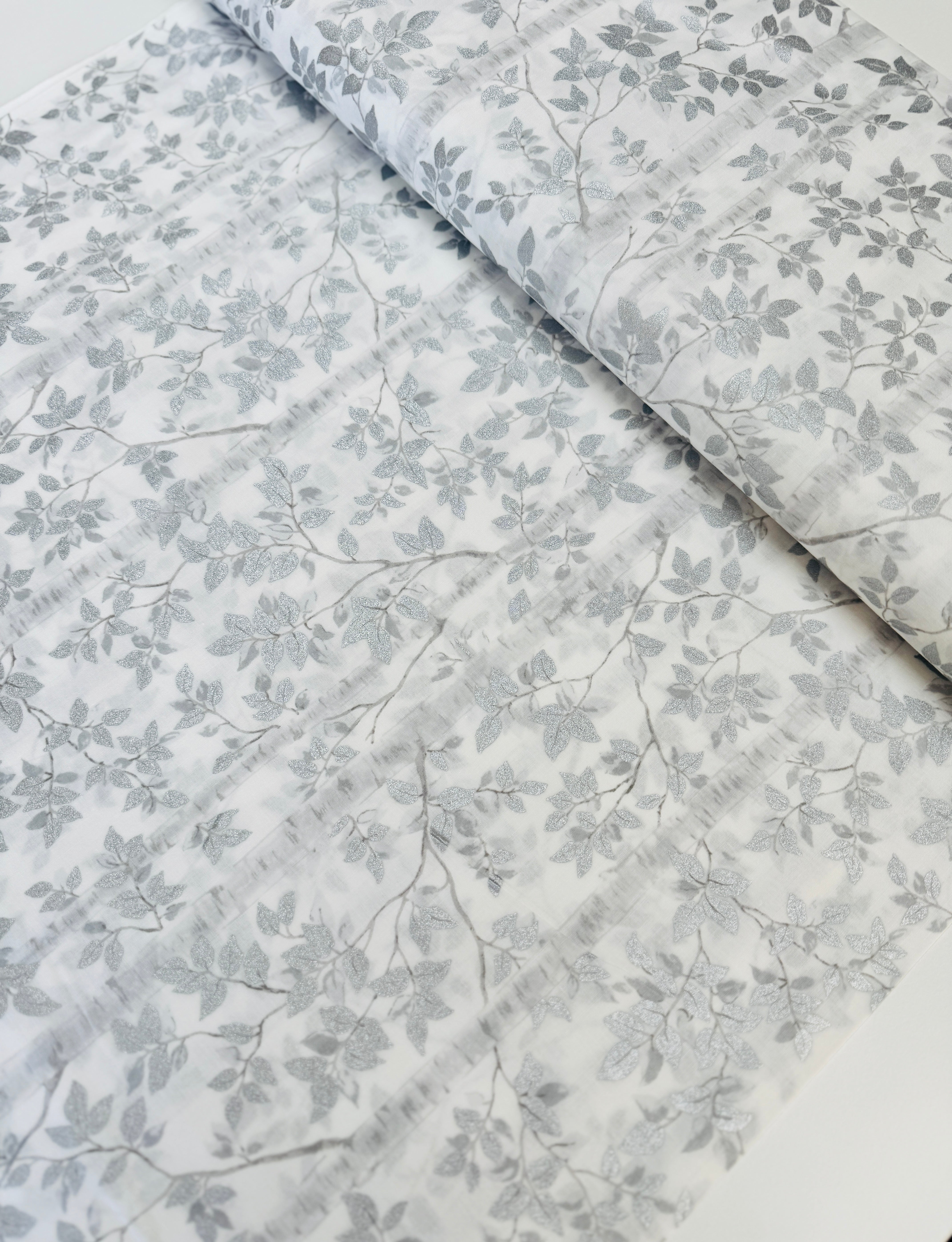 First Snowfall fabric with silver metallic leaves on white background by Hoffman Fabrics – quilting and holiday cotton.