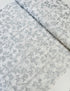 First Snowfall fabric with silver metallic leaves on white background by Hoffman Fabrics – quilting and holiday cotton.