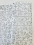 First Snowfall fabric with silver metallic leaves on white background by Hoffman Fabrics – quilting and holiday cotton.