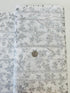 First Snowfall fabric with silver metallic leaves on white background by Hoffman Fabrics – quilting and holiday cotton.