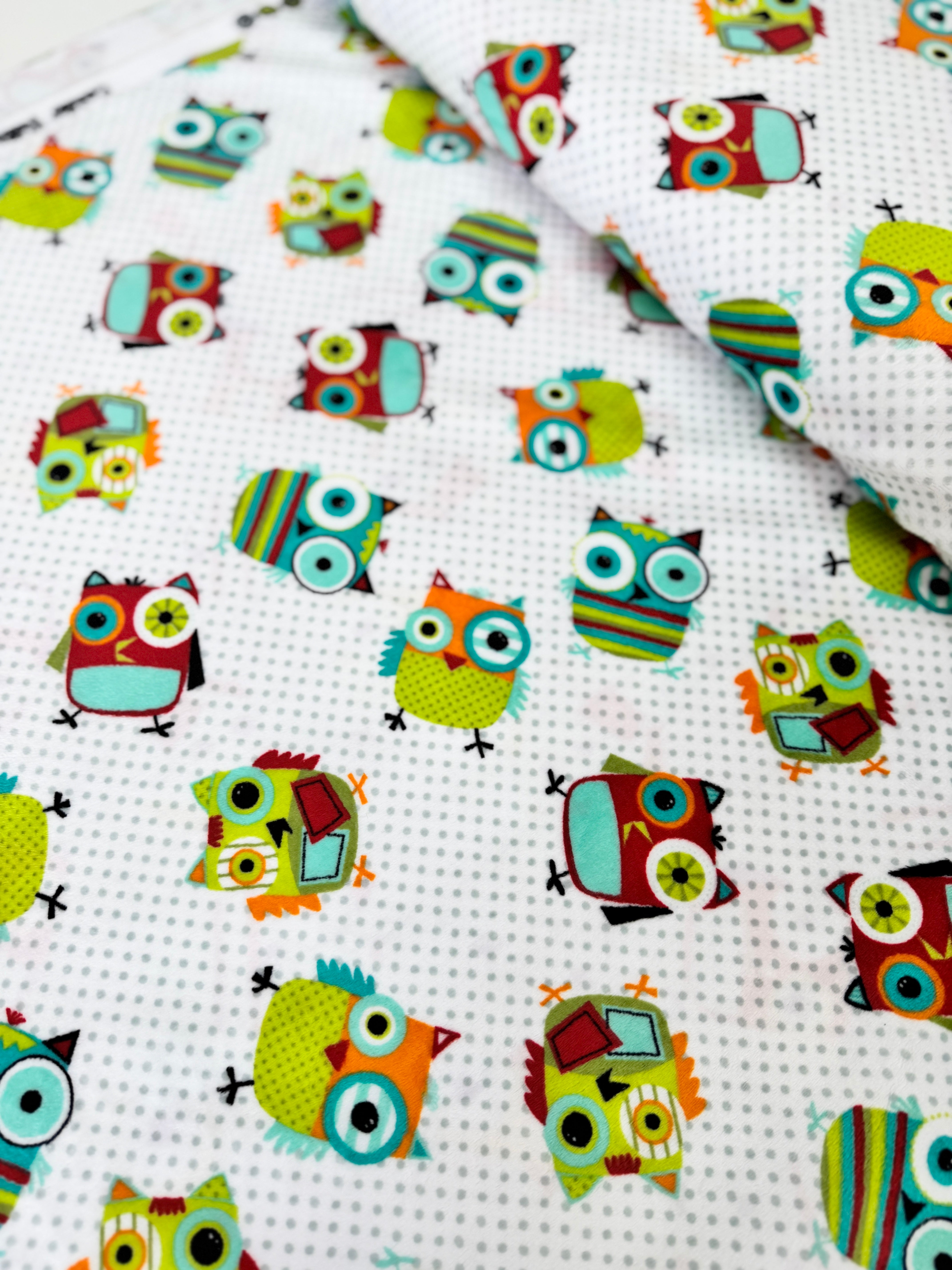 Hooty Cuddle Snow minky fabric by Shannon Fabrics with whimsical owls on snowy white background.