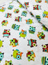 Hooty Cuddle Snow minky fabric by Shannon Fabrics with whimsical owls on snowy white background.