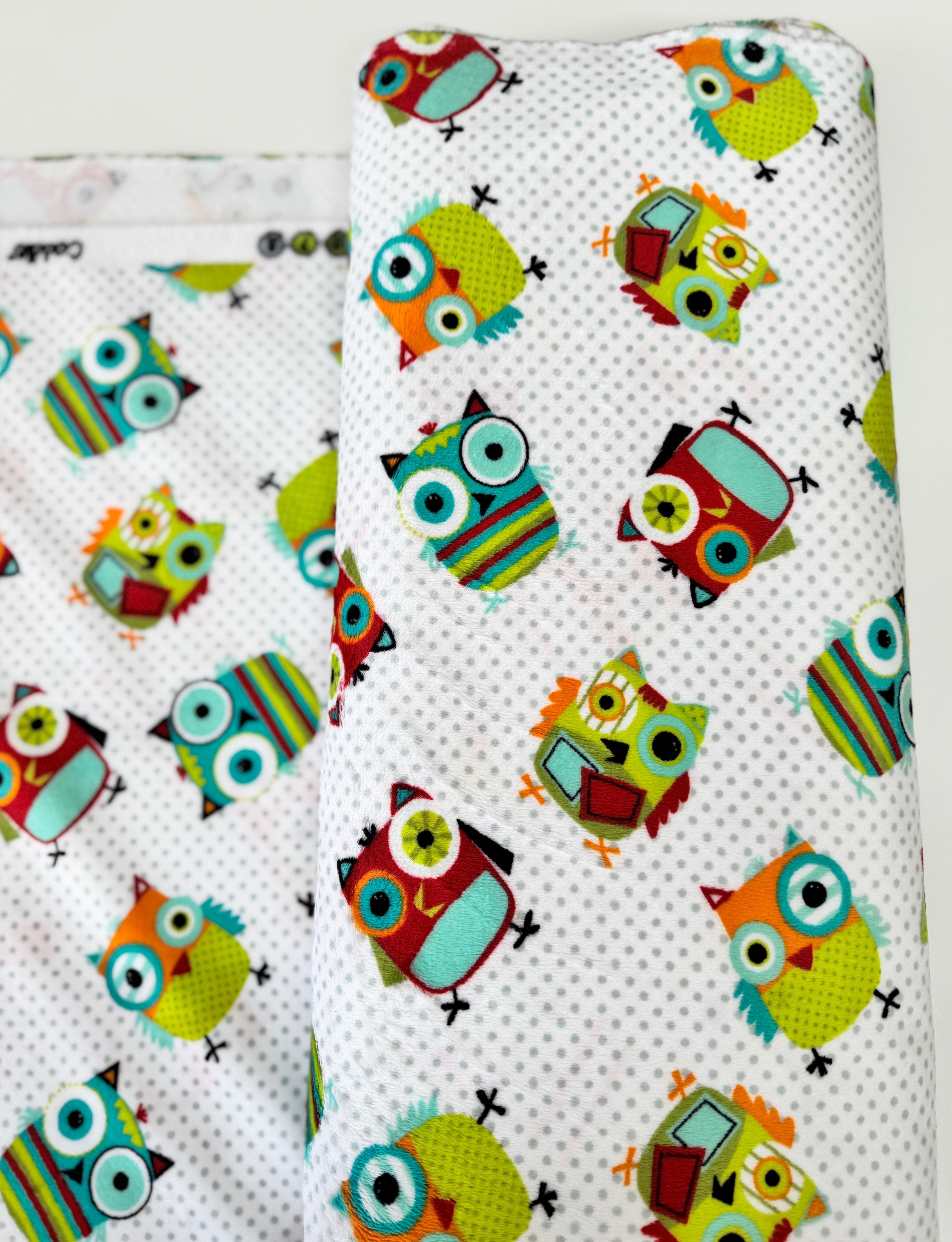 Hooty Cuddle Snow minky fabric by Shannon Fabrics with whimsical owls on snowy white background.
