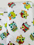 Hooty Cuddle Snow minky fabric by Shannon Fabrics with whimsical owls on snowy white background.