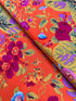 Kaffe Fassett Collective Gradi Floral Tomato fabric by Philip Jacobs for Free Spirit Fabrics featuring large bold floral blooms in pink and purple on a red background.