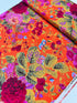 Kaffe Fassett Collective Gradi Floral Tomato fabric by Philip Jacobs for Free Spirit Fabrics featuring large bold floral blooms in pink and purple on a red background.